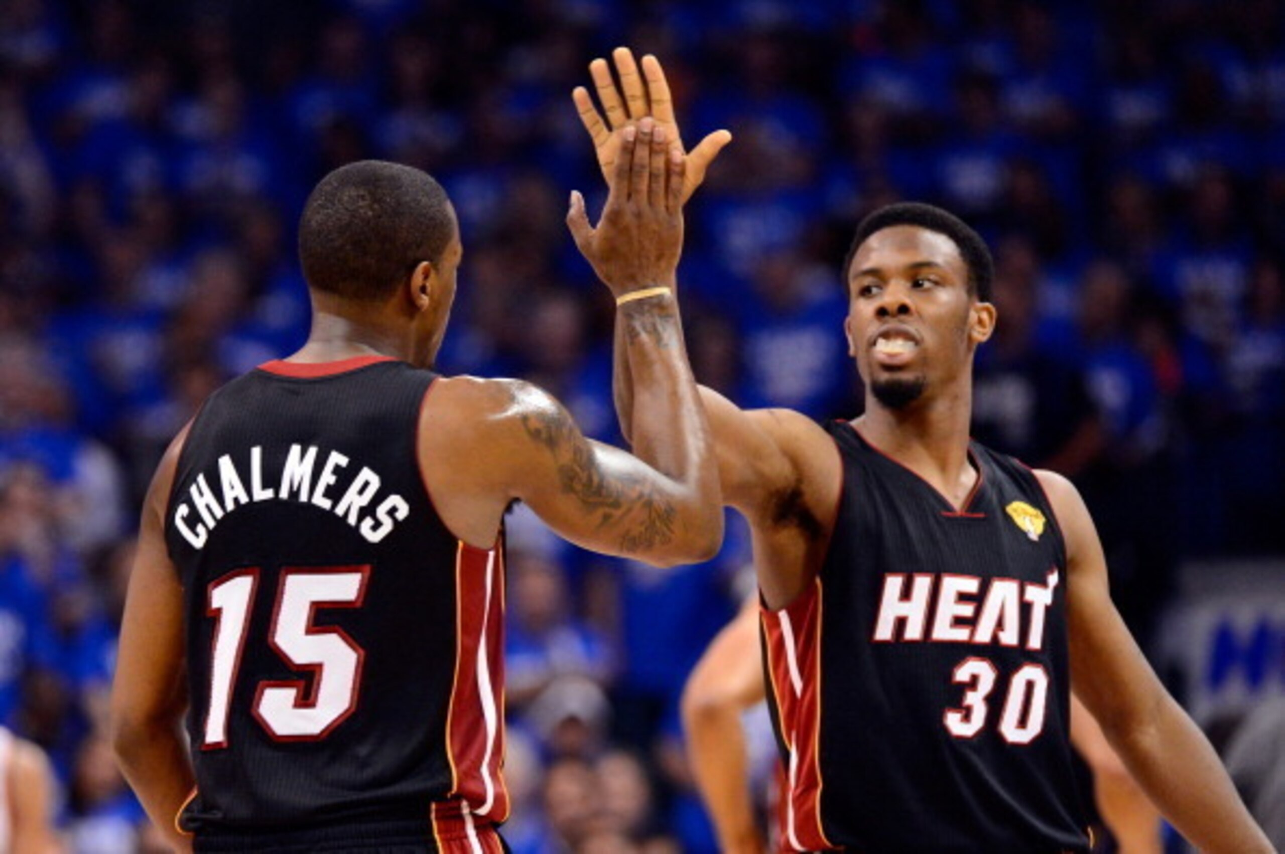OKLAHOMA CITY, OK - JUNE 14:  Mario Chalmers #15 and Norris Cole #30 of the Miami Heat celebrate a play in the first half while taking on the Oklahoma City Thunder in Game Two of the 2012 NBA Finals at Chesapeake Energy Arena on June 14, 2012 in Oklahoma 