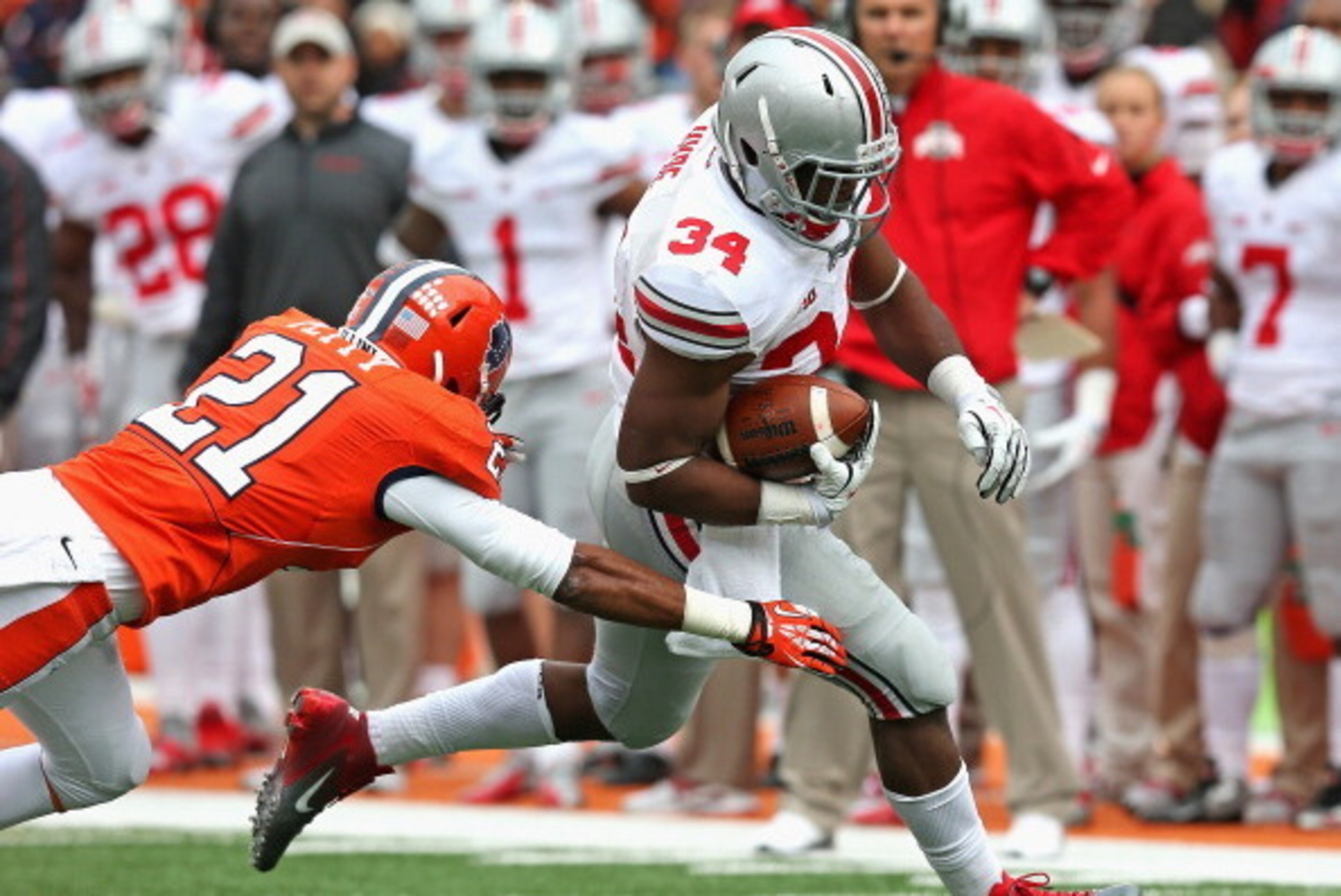 CHAMPAIGN, IL - NOVEMBER 16: Carlos Hyde #34 of the Ohio State Buckeyes breaks a tackle attempt by Zane Petty #21 of the Illinois Fighting Illini to score a touchdown at Memorial Stadium on November 16, 2013 in Champaign, Illinois. (Photo by Jonathan Dani CHAMPAIGN, IL - NOVEMBER 16: Carlos Hyde #34 of the Ohio State Buckeyes breaks a tackle attempt by Zane Petty #21 of the Illinois Fighting Illini to score a touchdown at Memorial Stadium on November 16, 2013 in Champaign, Illinois. (Photo by Jonathan Dani