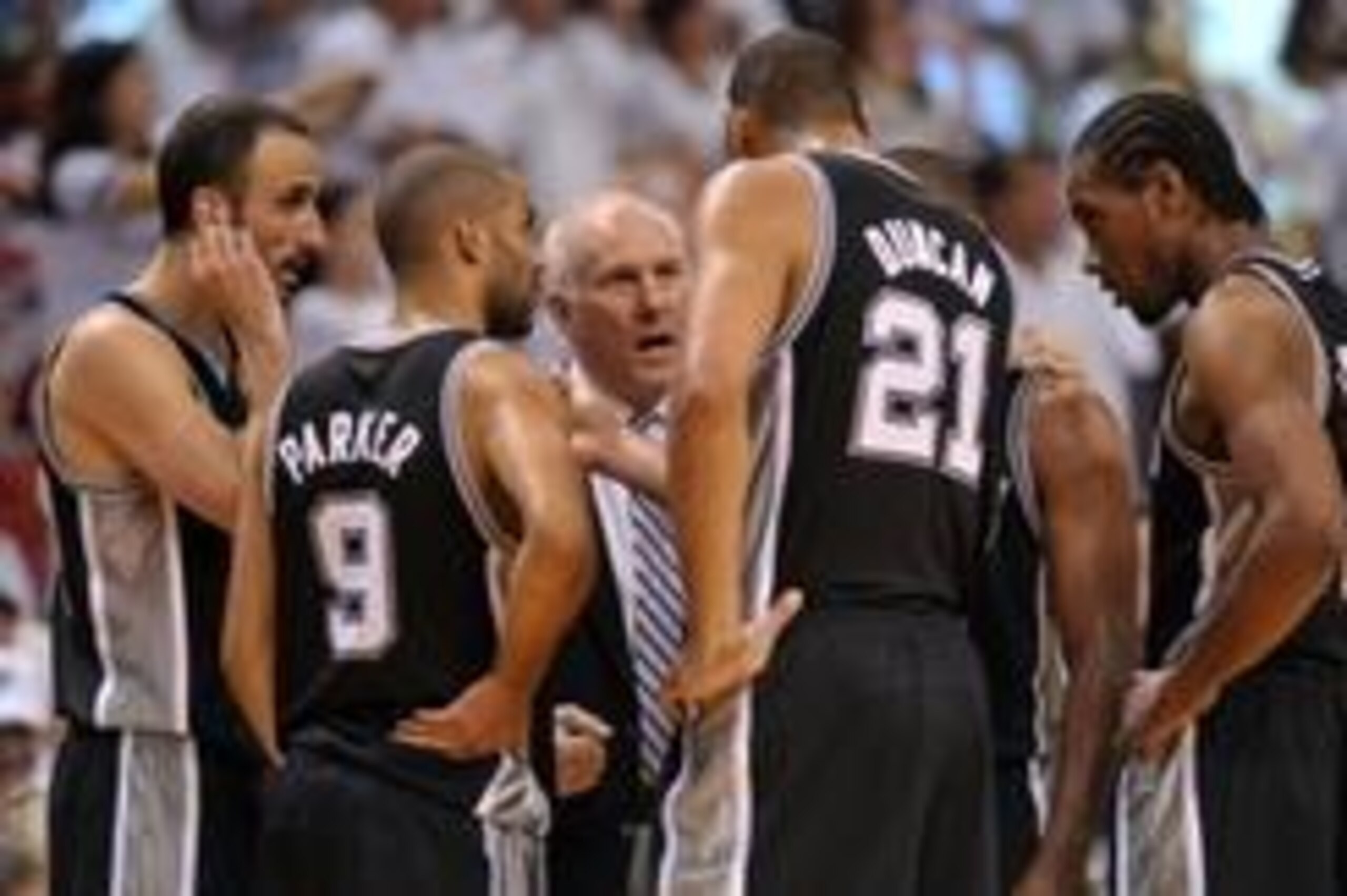 Jun 20, 2013; Miami, FL, USA; San Antonio Spurs head coach Gregg Popovich talks with San Antonio Spurs power forward Tim Duncan (21), point guard Tony Parker (9), and shooting guard Manu Ginobili (left) during the fourth quarter of game seven in the 2013 Jun 20, 2013; Miami, FL, USA; San Antonio Spurs head coach Gregg Popovich talks with San Antonio Spurs power forward Tim Duncan (21), point guard Tony Parker (9), and shooting guard Manu Ginobili (left) during the fourth quarter of game seven in the 2013