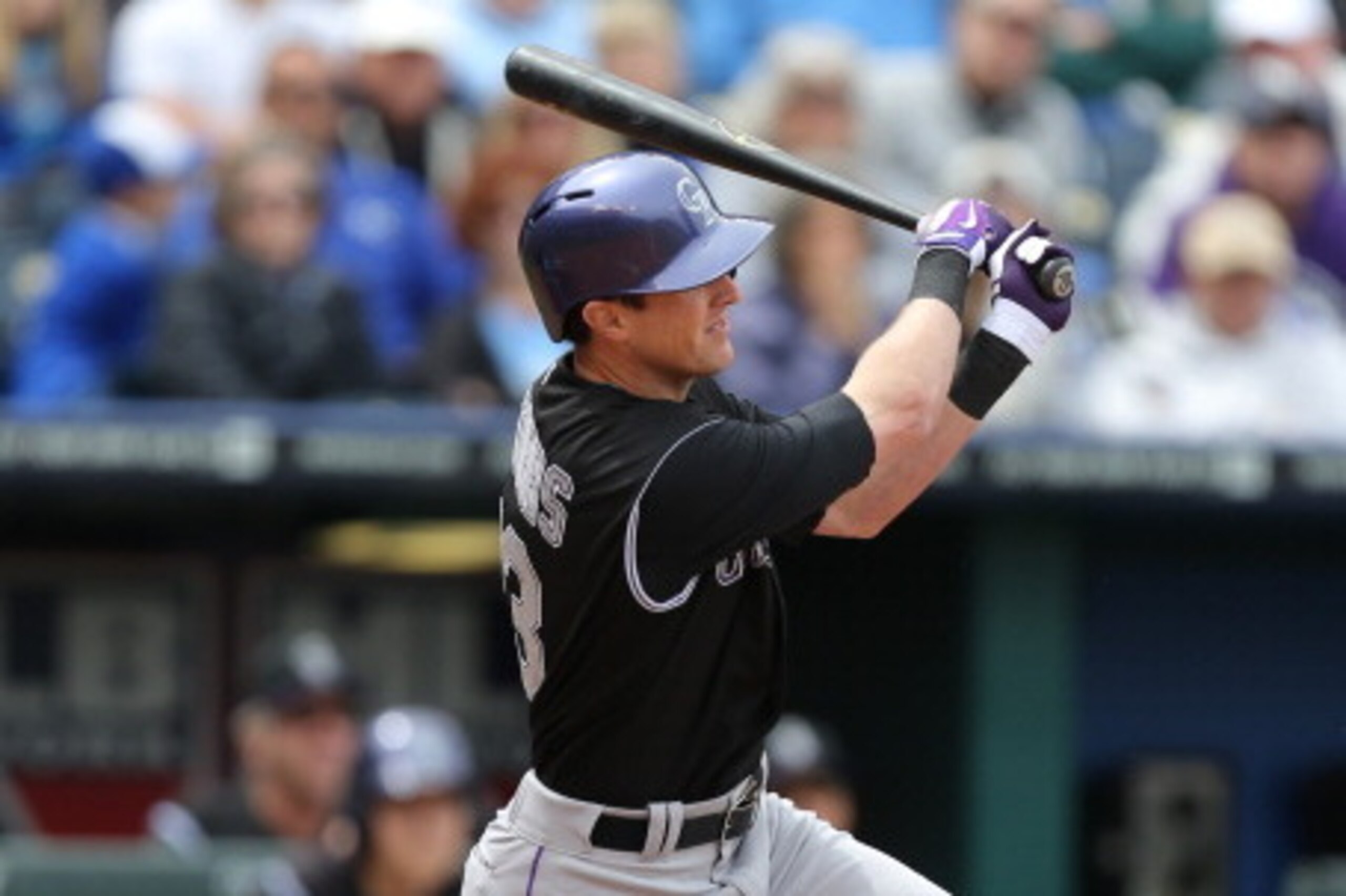 KANSAS CITY, MO - MAY 14:  Drew Stubbs #13 of the Colorado Rockies hits a two-run home run in the seventh inning against the Kansas City Royals at Kauffman Stadium on May 14, 2014 in Kansas City, Missouri. (Photo by Ed Zurga/Getty Images)