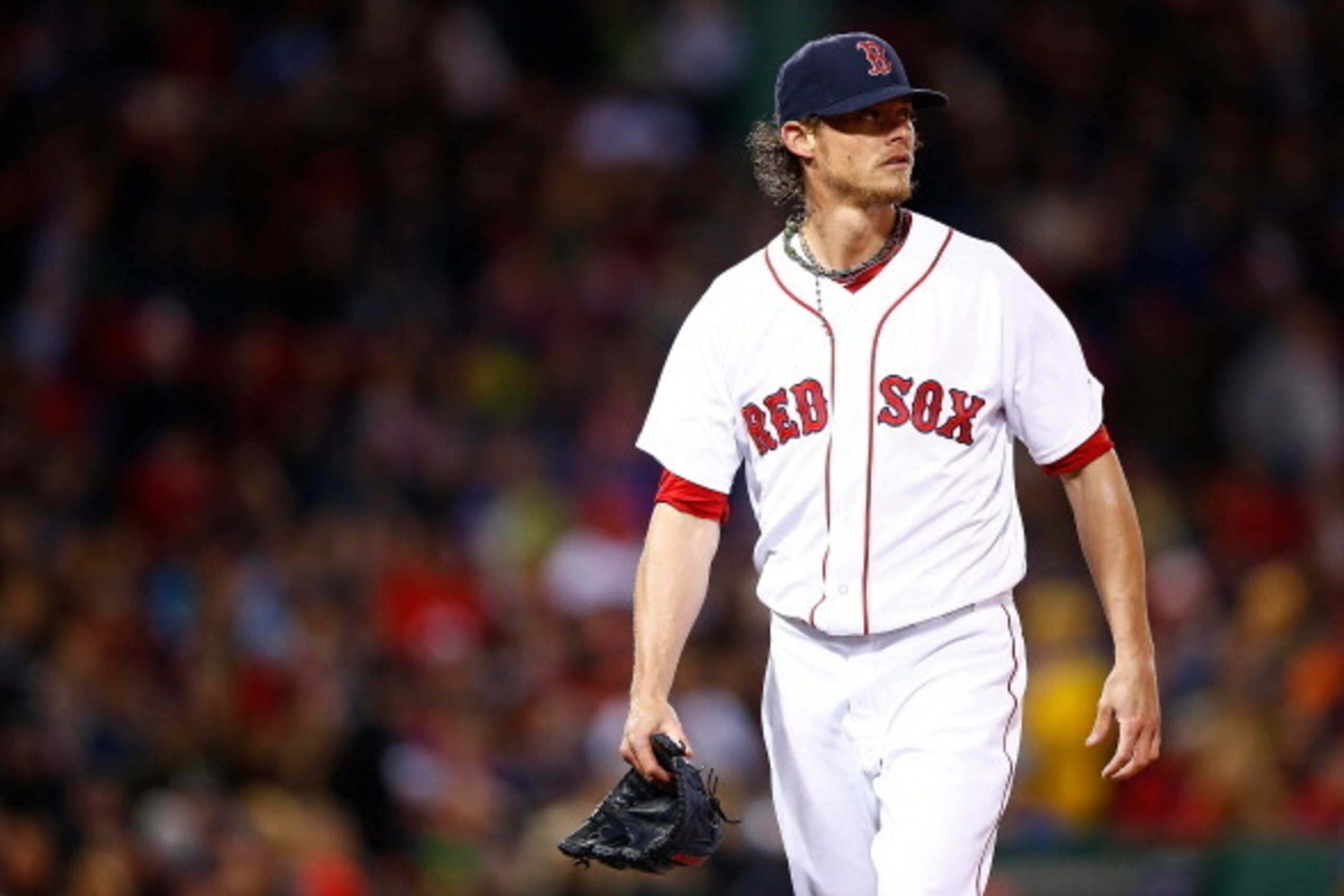 BOSTON, MA - APRIL 05:  Clay Buccholz #11 of the Boston Red Sox pitches against the Milwaukee Brewers durng the game at Fenway Park on April 5, 2014 in Boston, Massachusetts.  (Photo by Jared Wickerham/Getty Images)