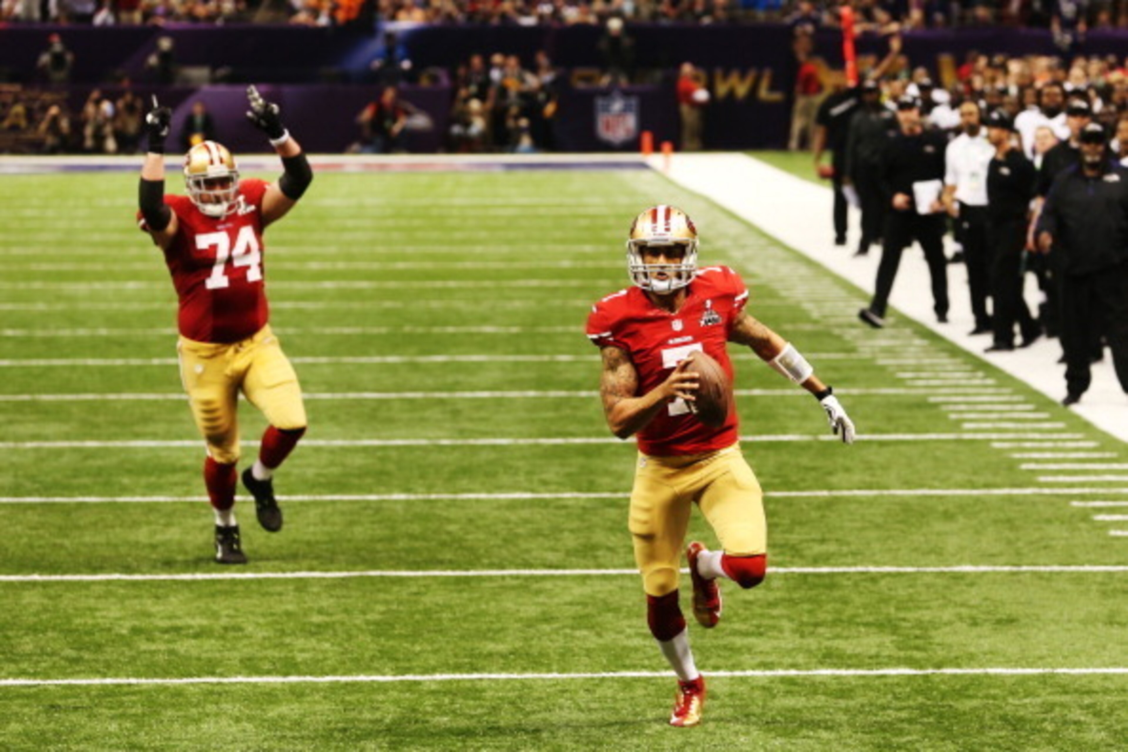 NEW ORLEANS, LA - FEBRUARY 03:  Colin Kaepernick #7 of the San Francisco 49ers runs into the endzone for a 15-yard rushing touchdown in the fourth quarter as teammate Joe Staley #74 against the Baltimore Ravens during Super Bowl XLVII at the Mercedes-Benz