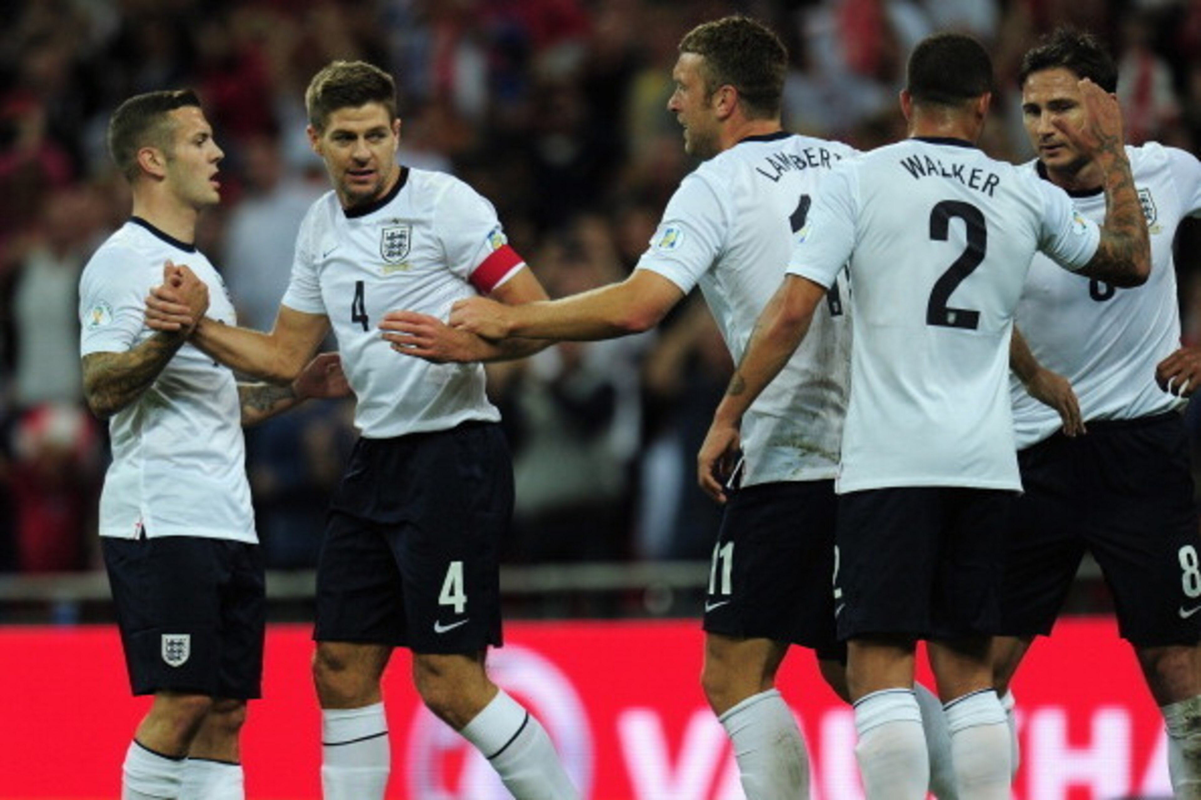 LONDON, ENGLAND - SEPTEMBER 06:  Steven Gerrard of England is congratulated by Jack Wilshere of England on scoring the opening goal during the FIFA 2014 World Cup Qualifying Group H match between England and Moldova at Wembley Stadium on September 6, 2013