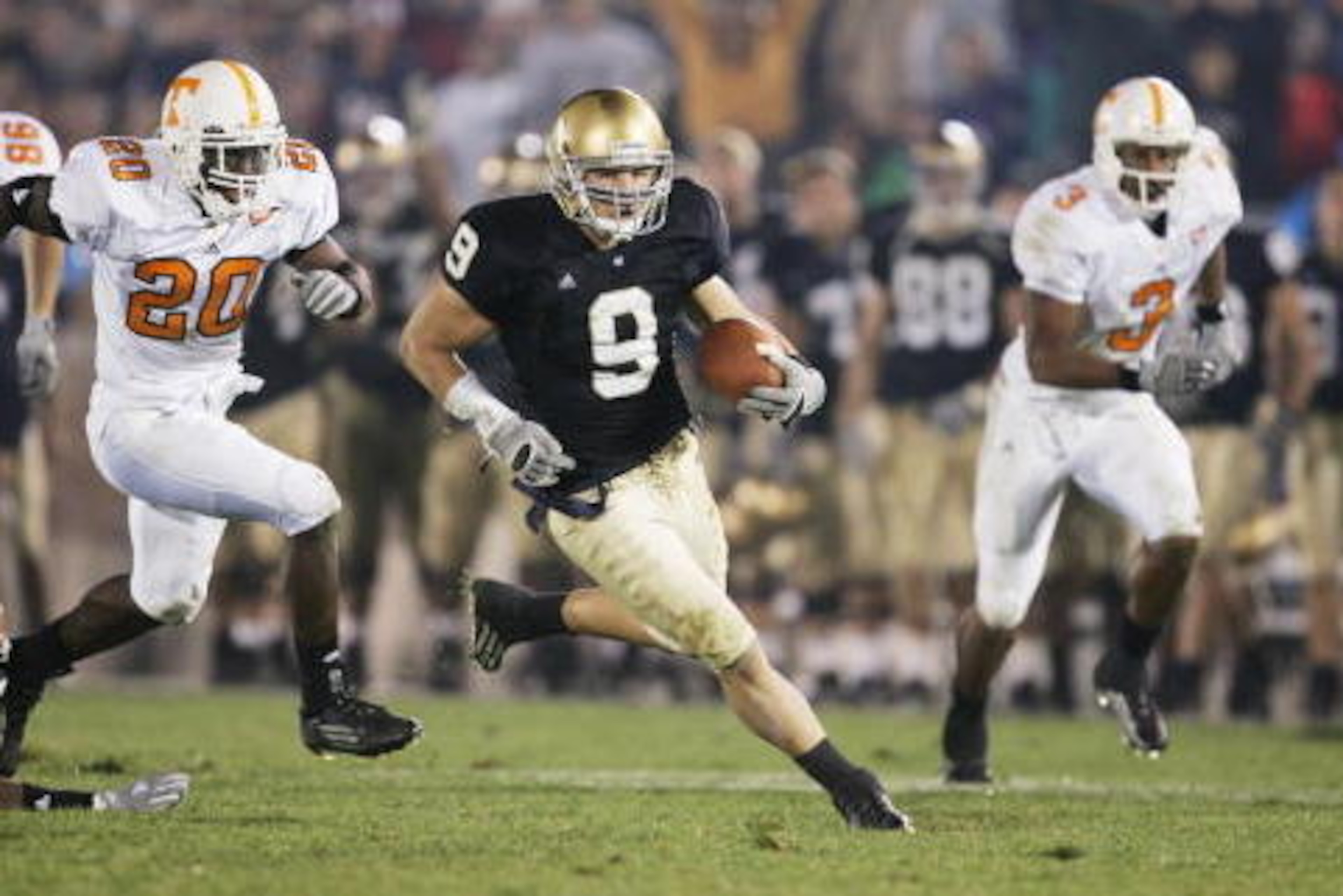 SOUTH BEND, IN - NOVEMBER 5:  Punt returner Tom Zbikowski #9 of the Notre Dame Fighting Irish carries the ball against the Tennessee Volunteers on November 5, 2005 at Notre Dame Stadium in South Bend, Indiana. The Irish defeated the Vols 41-21.  (Photo by