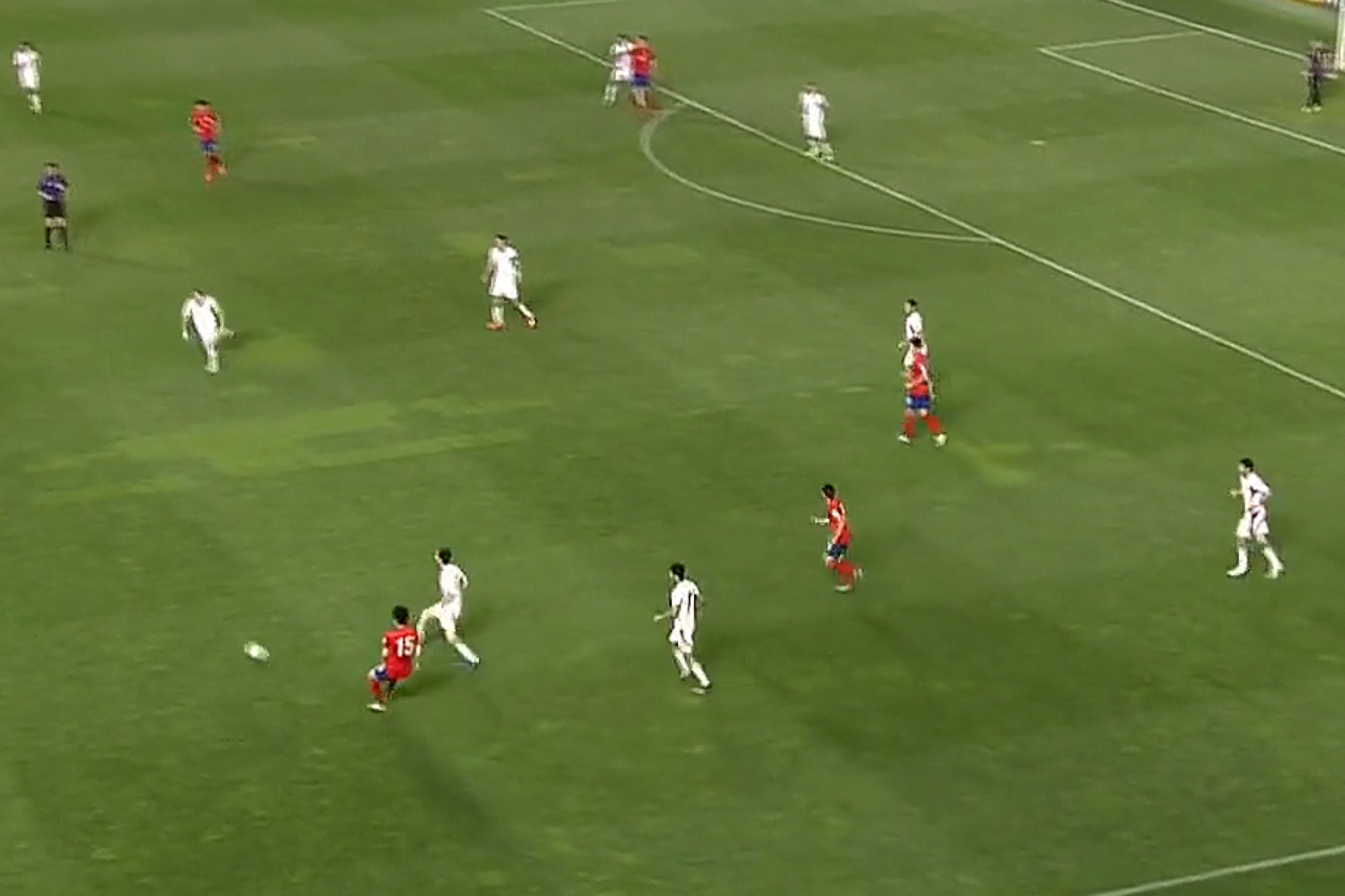 Iran aggressively pursue the ball as it enters their territory.