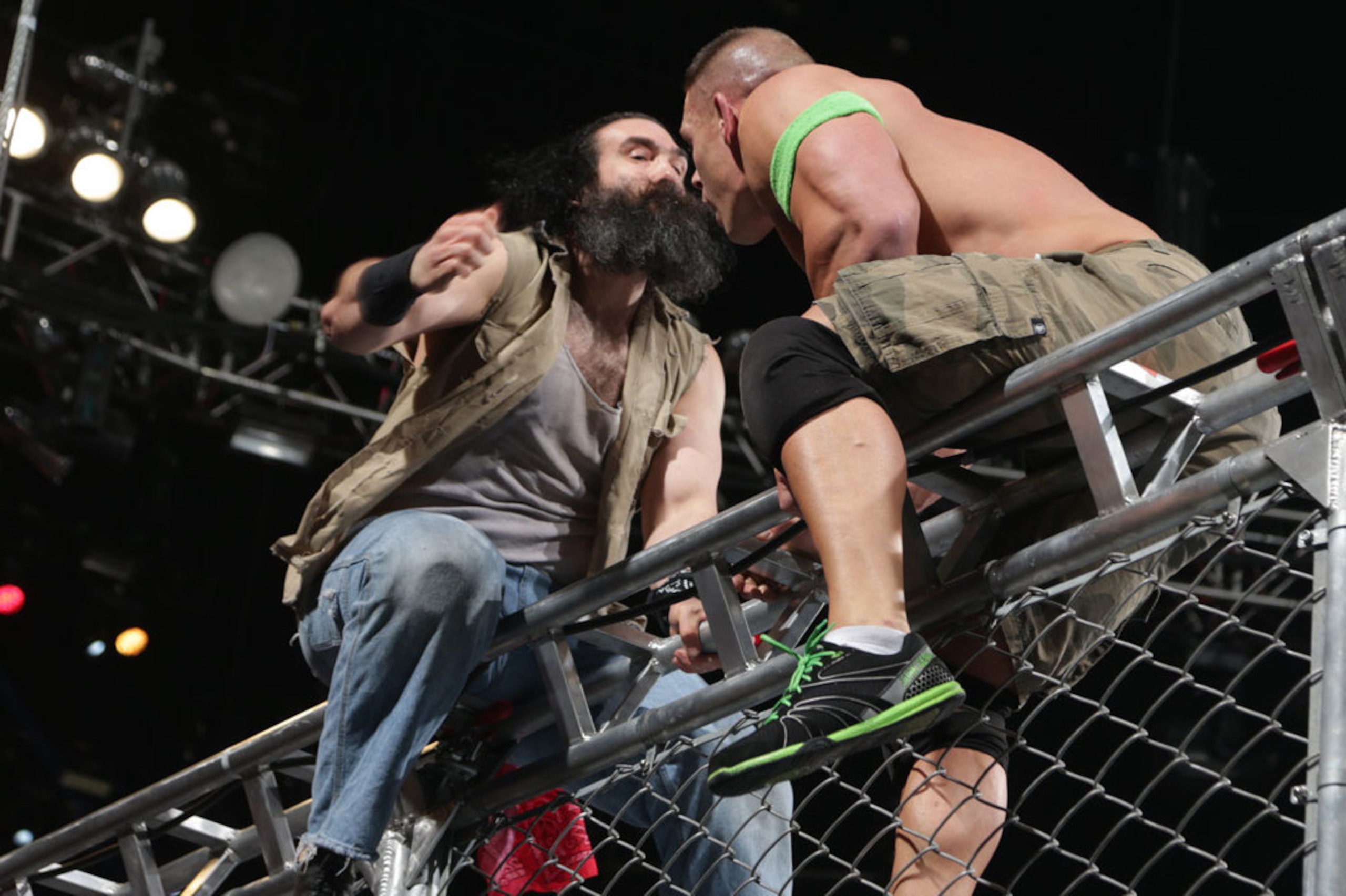 Luke Harper interferes in John Cena's cage match with Bray Wyatt.