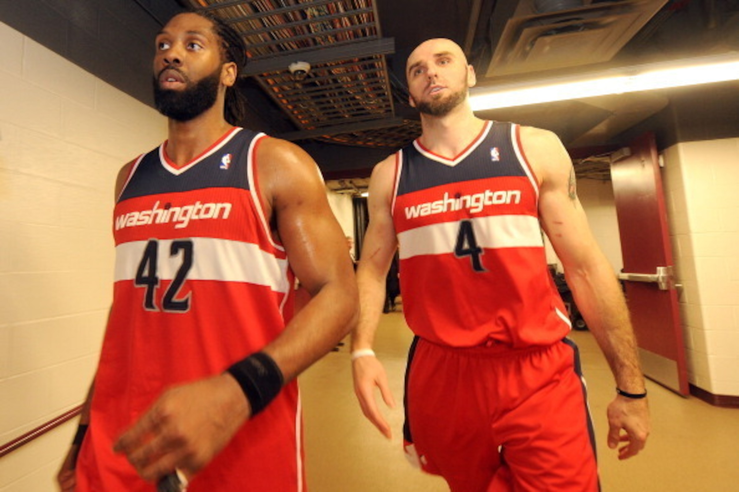 CHICAGO, IL - APRIL 29: Nene #42 and Marcin Gortat #4 of the Washington Wizards leave the court after Game 5 of the Eastern Conference Quarterfinals against the Chicago Bulls in the 2014 NBA Playoffs on April 29, 2014 at the United Center in Chicago, Illi