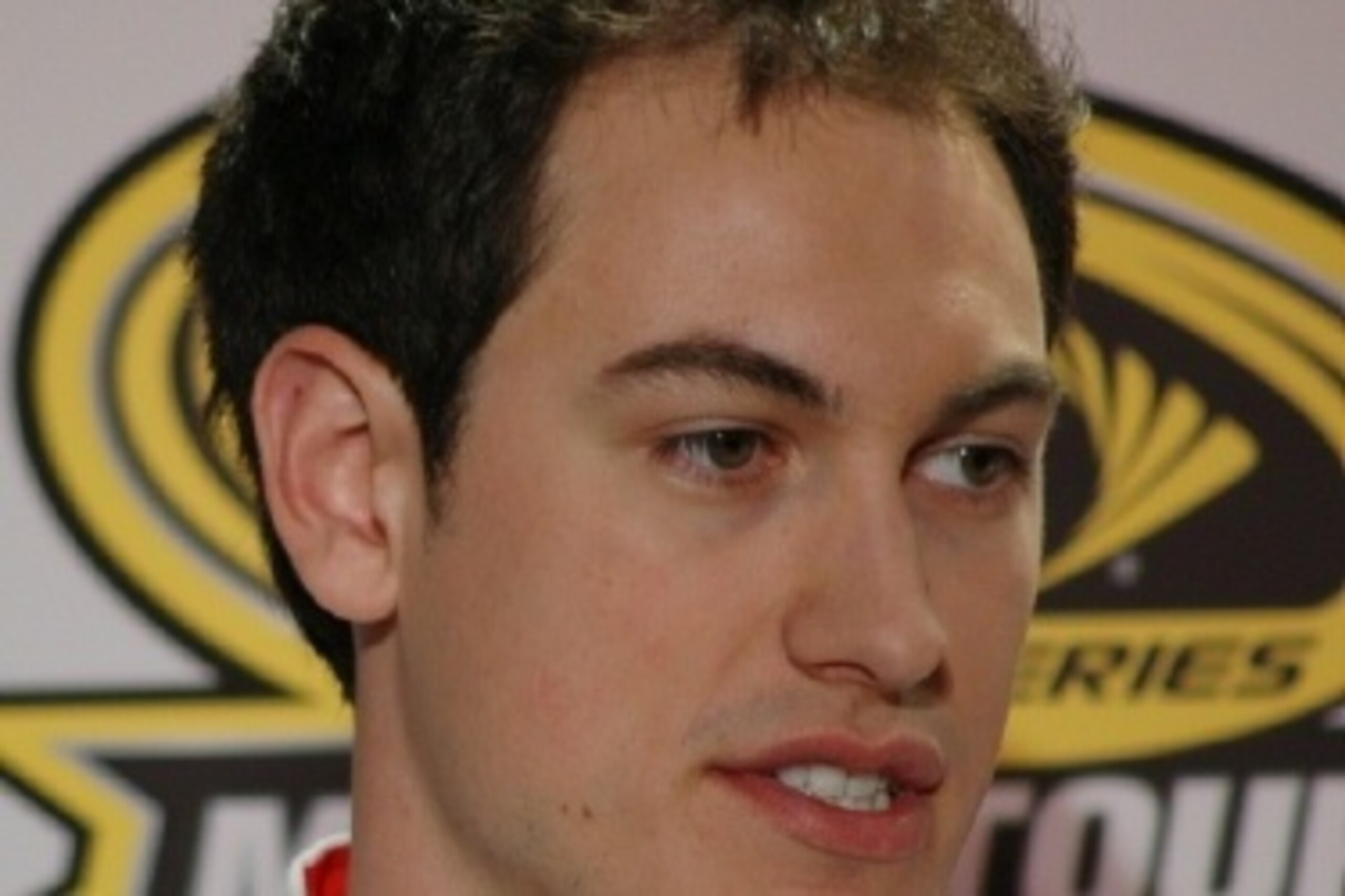 Joey Logano answers media in Charlotte before the 2014 season.