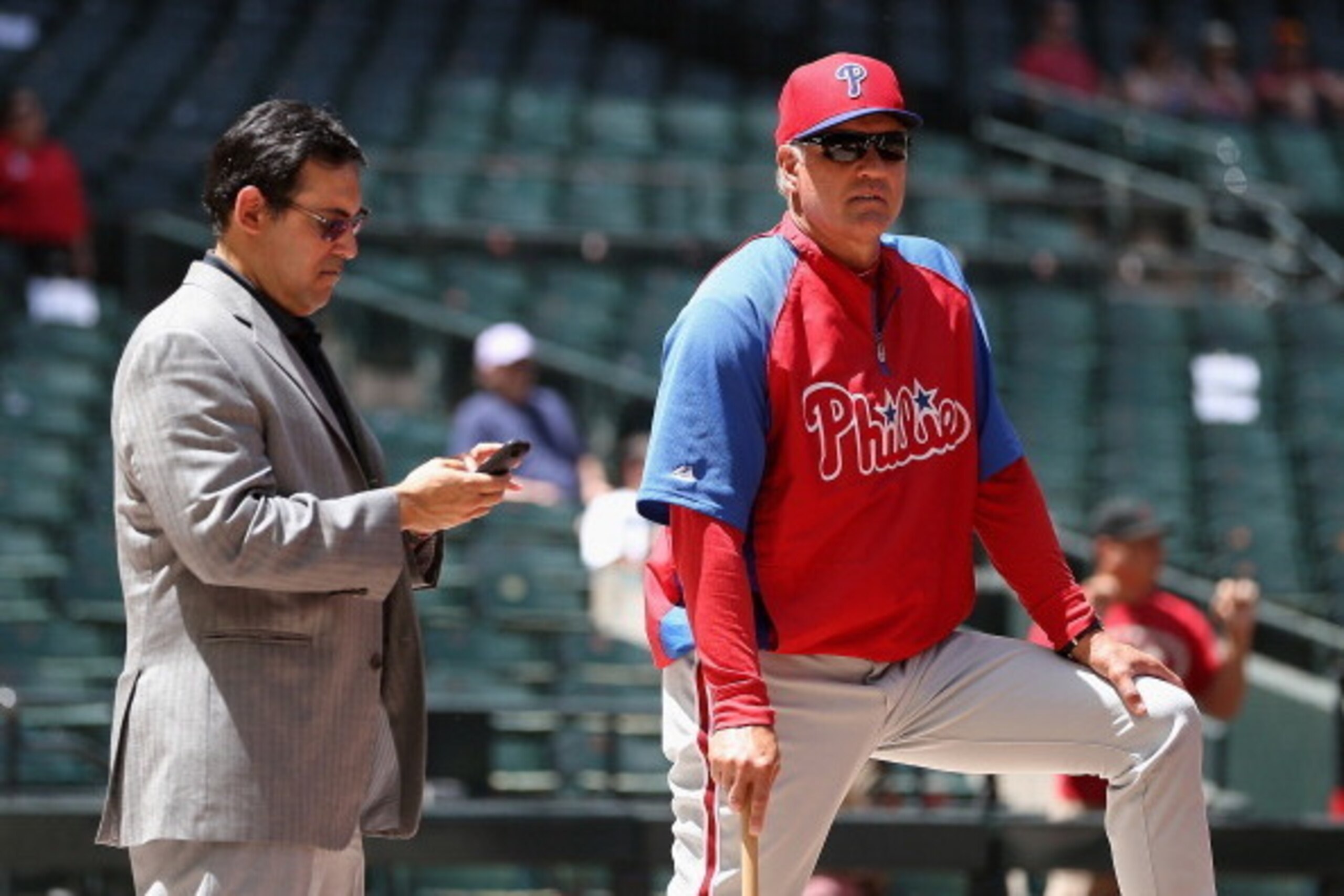 PHOENIX, AZ - APRIL 27:  General manager Ruben Amaro and manager Ryne Sandberg of the Philadelphia Phillies watch bating practice before the MLB game against the Arizona Diamondbacks at Chase Field on April 27, 2014 in Phoenix, Arizona. The Phillies defea
