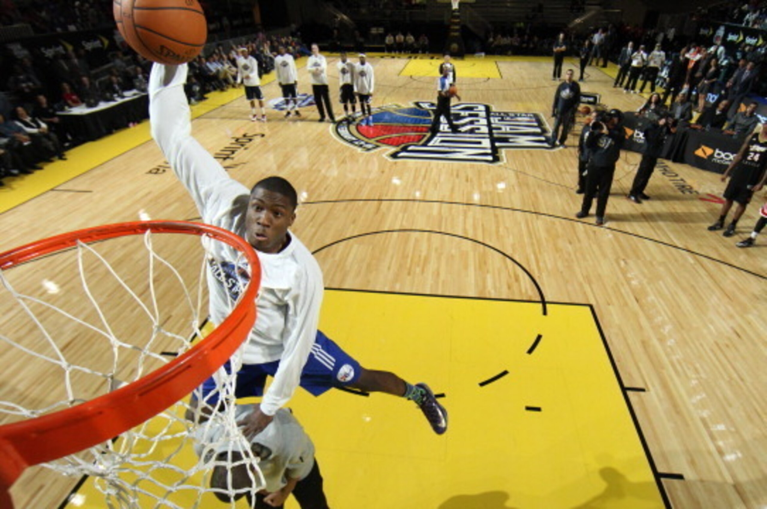 NEW ORLEANS, LA - FEBRUARY 15: Thanasis Antetokounmpo #19 of the Deleware 87ers dunks over his brother, Giannis Antetokounmpo of the Milwaukee Bucks during the Slam Dunk Contest as part of the NBA Dream Factory presented by Boost Mobile 2014 at Sprint Ar NEW ORLEANS, LA - FEBRUARY 15: Thanasis Antetokounmpo #19 of the Deleware 87ers dunks over his brother, Giannis Antetokounmpo of the Milwaukee Bucks during the Slam Dunk Contest as part of the NBA Dream Factory presented by Boost Mobile 2014 at Sprint Ar