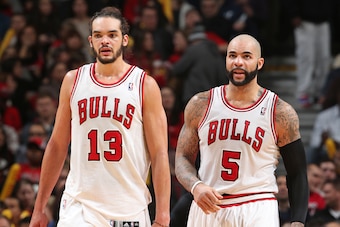 CHICAGO, IL - JANUARY 24: Joakim Noah #13 and Carlos Boozer #5 of the Chicago Bulls looks on during the game against the Los Angeles Clippers on January 24, 2014 at the United Center in Chicago, Illinois. NOTE TO USER: User expressly acknowledges and agre