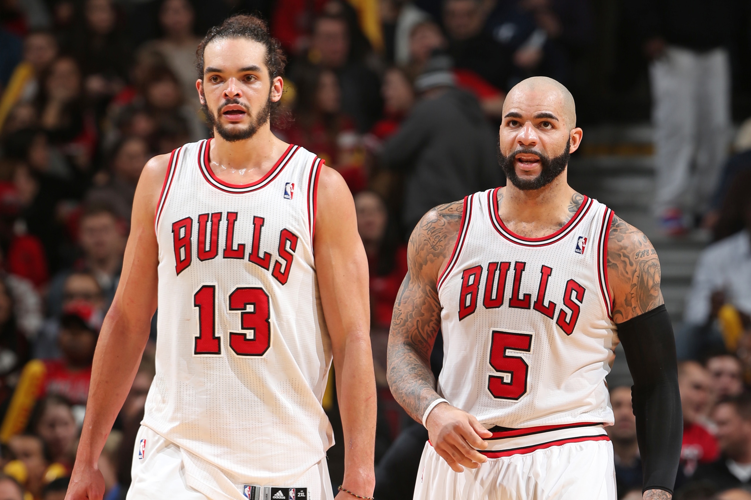 CHICAGO, IL - JANUARY 24: Joakim Noah #13 and Carlos Boozer #5 of the Chicago Bulls looks on during the game against the Los Angeles Clippers on January 24, 2014 at the United Center in Chicago, Illinois. NOTE TO USER: User expressly acknowledges and agre