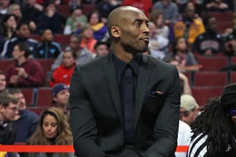 CHICAGO, IL - JANUARY 20: Kobe Bryant #24 of the Los Angeles Lakers watches from the bench as his teammates take on the Chicago Bulls at the United Center on January 20, 2014 in Chicago, Illinois. NOTE TO USER: User expressly acknowledges and agrees that,