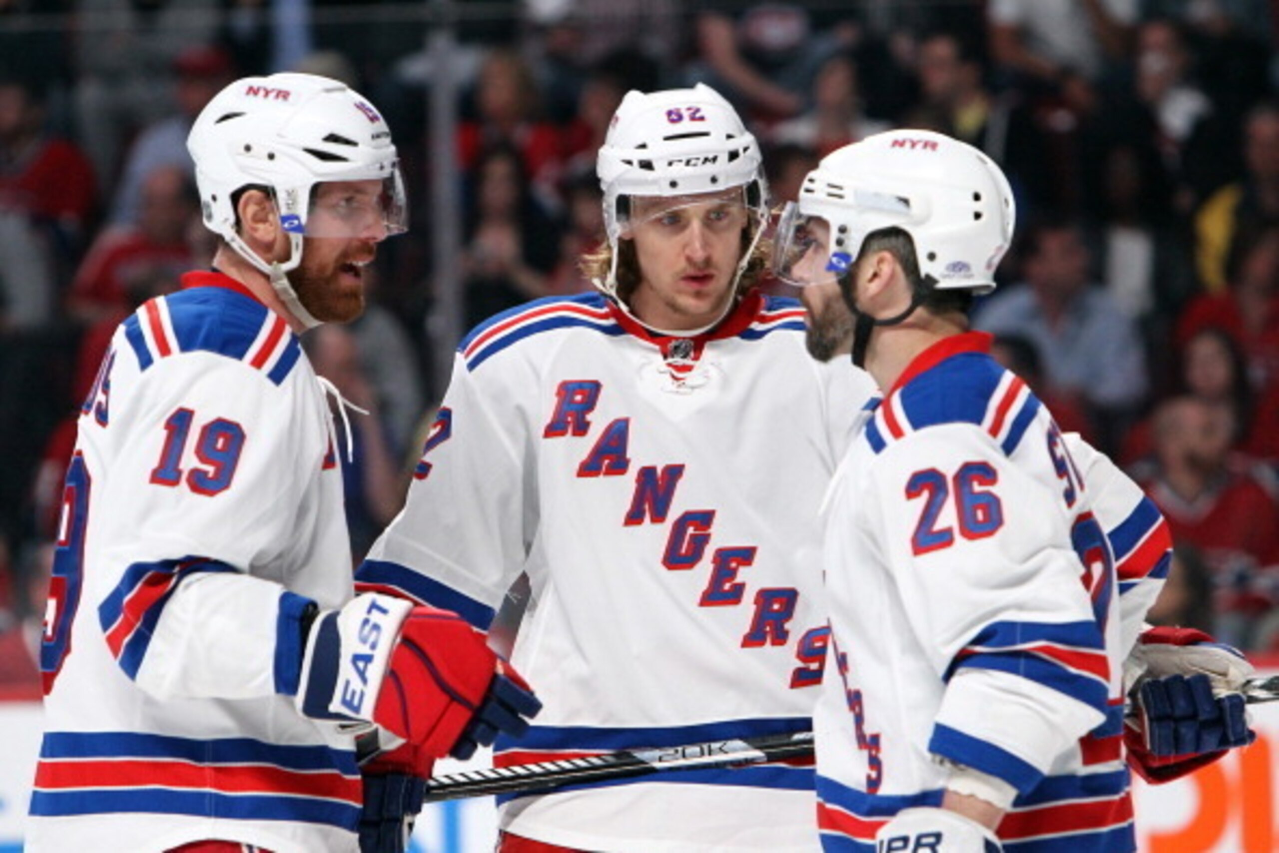 MONTREAL, QC - MAY 19:  Martin St. Louis #26 of the New York Rangers talks with Carl Hagelin #62 and Brad Richards #19 against the Montreal Canadiens during the third period in Game Two of the Eastern Conference Final during the 2014 Stanley Cup Playoffs 