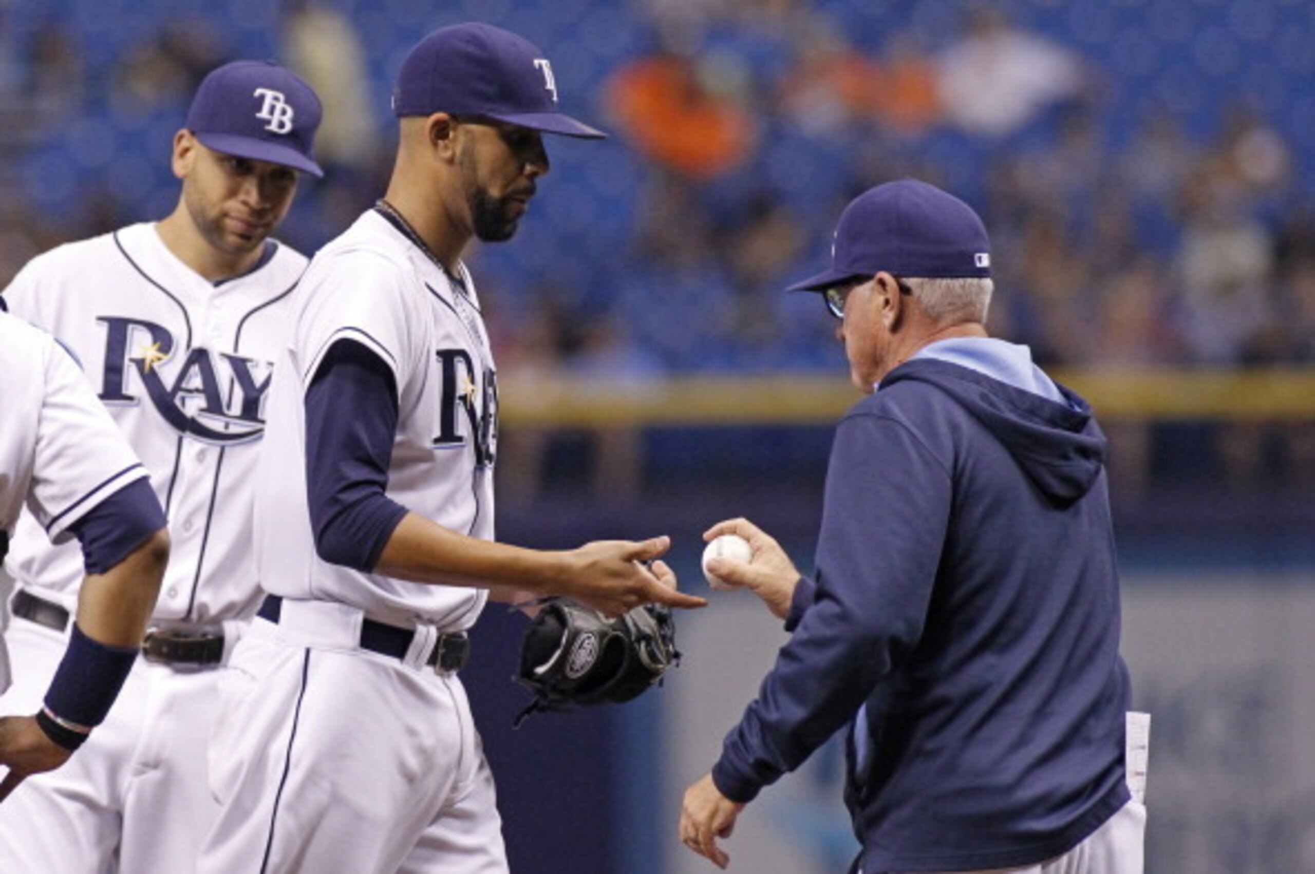 ST. PETERSBURG, FL - MAY 8: Pitcher David Price #14 of the Tampa Bay Rays is taken off the mound by manager Joe Maddon #70 of the Tampa Bay Rays after walking J.J. Hardy of the Baltimore Orioles to load the bases during the seventh inning of a game on May