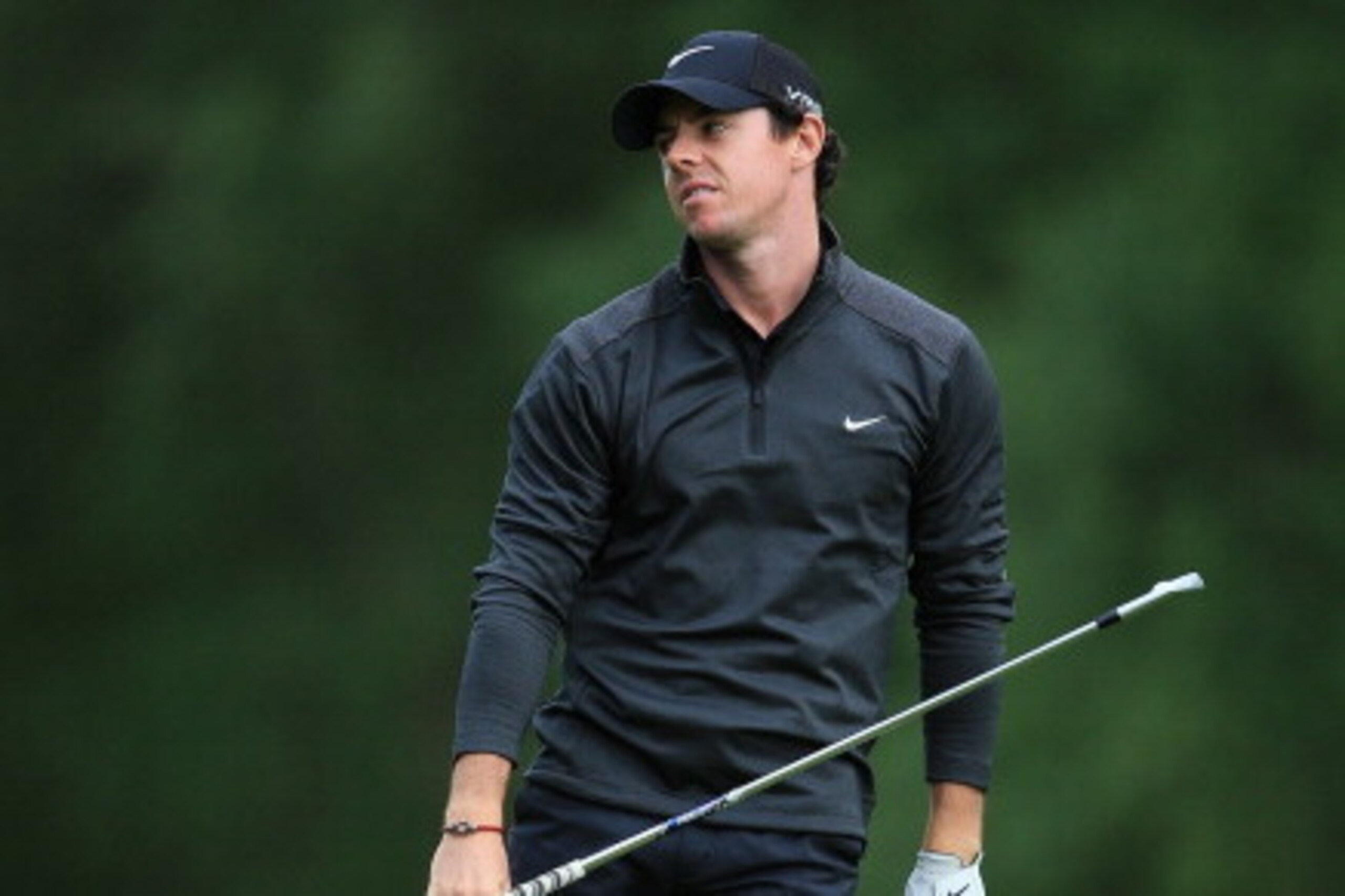 VIRGINIA WATER, ENGLAND - MAY 22: Rory McIlroy of Northern Ireland reacts on the 9th hole during day one of the BMW PGA Championship at Wentworth on May 22, 2014 in Virginia Water, England.  (Photo by David Cannon/Getty Images)