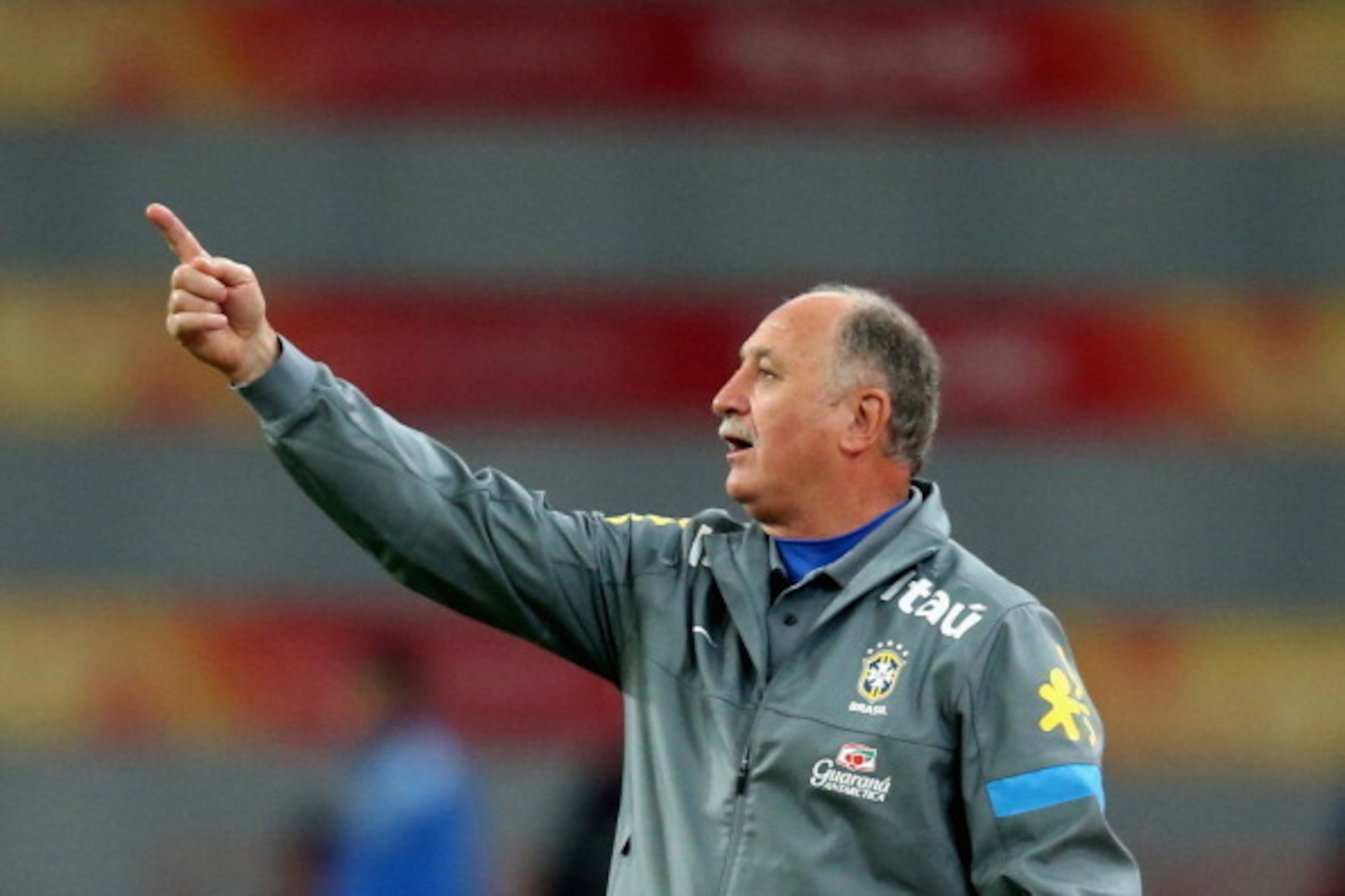 BEIJING, CHINA - OCTOBER 15:  Brazilian football team coach Luiz Felipe Scolari reacts during the international friendly match between Brazil and Zambia at Beijing National Stadium on October 15, 2013 in Beijing, China.  (Photo by Feng Li/Getty Images)