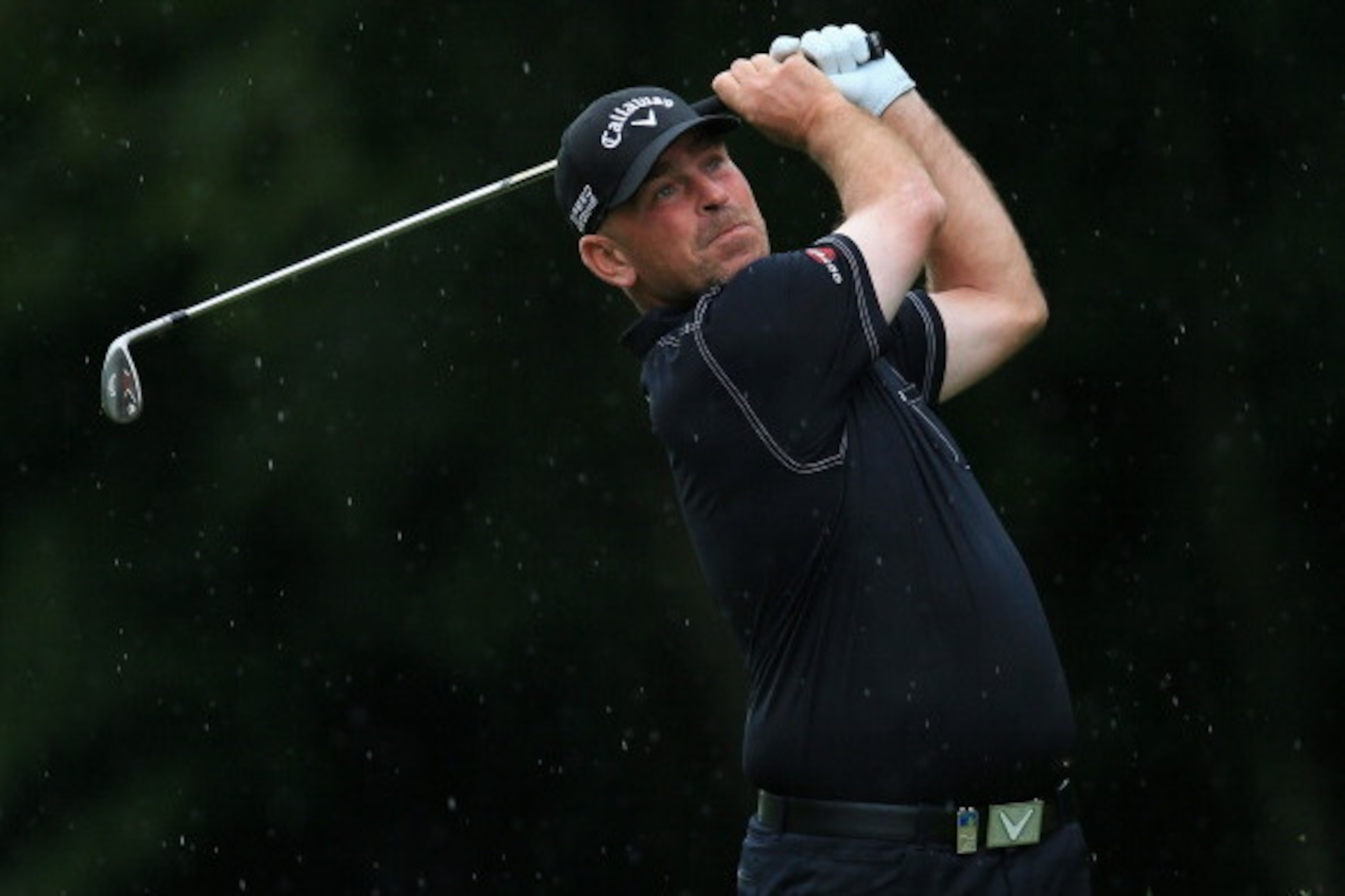 VIRGINIA WATER, ENGLAND - MAY 22:  Thomas Bjorn of Denmark hits an approach shot during day one of the BMW PGA Championship at Wentworth on May 22, 2014 in Virginia Water, England.  (Photo by David Cannon/Getty Images)