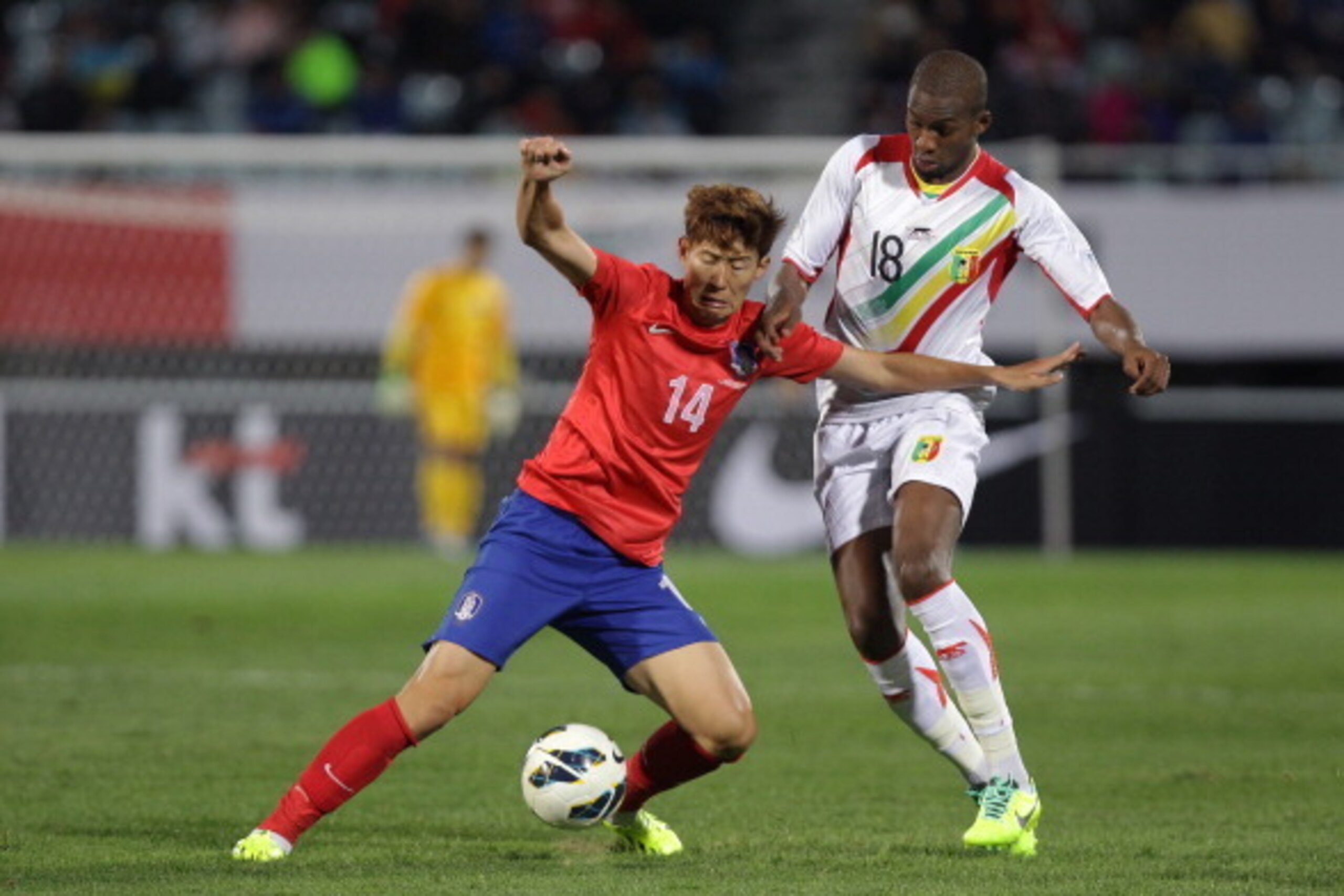 CHEONAN, SOUTH KOREA - OCTOBER 15:  Son Heung-Min of South Korea competes for the ball with Samba Sow of Mali during the international friendly match between South Korea and Mali at Cheonan Stadium on October 15, 2013 in Cheonan, South Korea.  (Photo by C