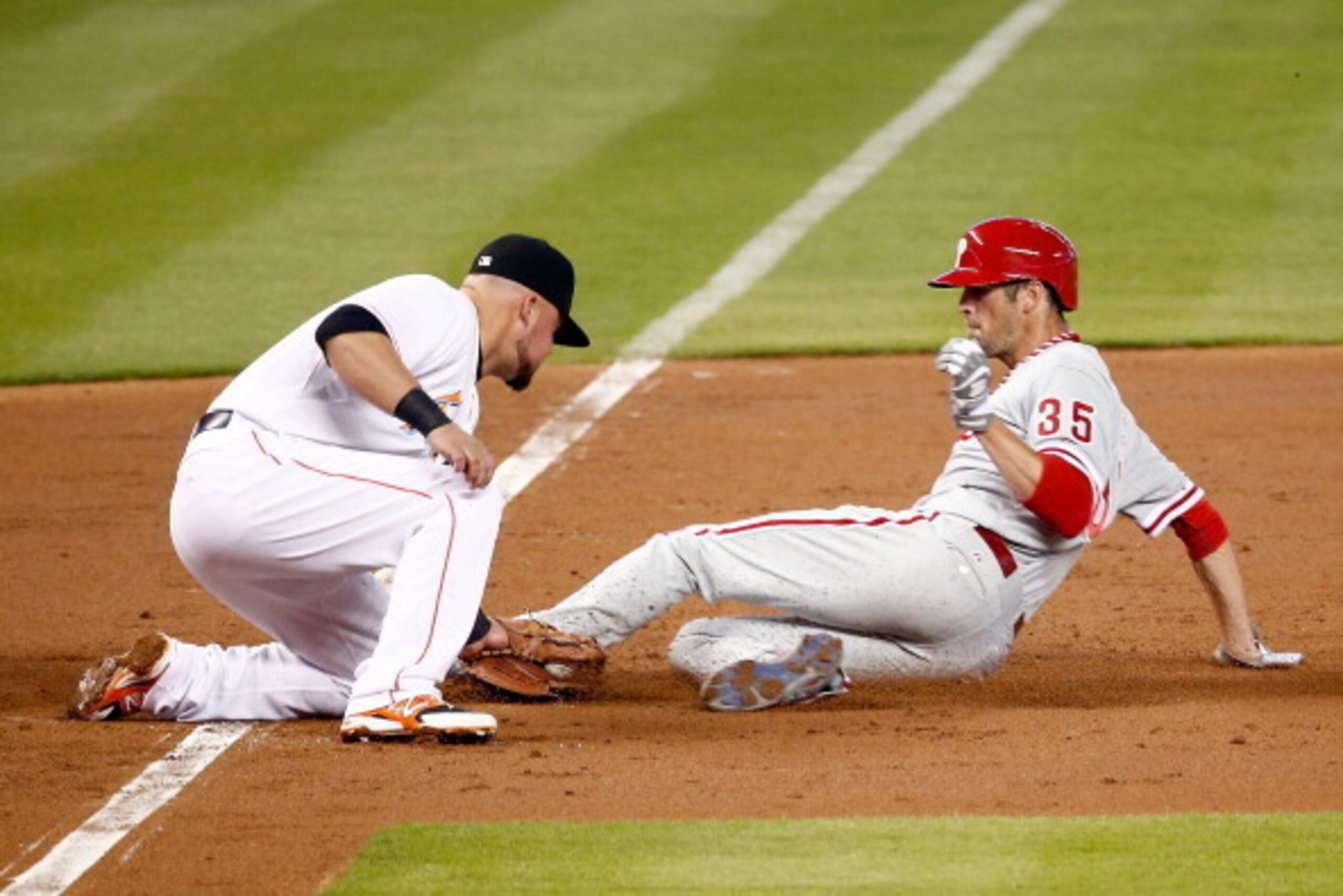 MIAMI, FL - MAY 22: Casey McGehee #9 of the Miami Marlins tags out Cole Hamels #35 of the Philadelphia Phillies during the third inning of the game at Marlins Park on May 22, 2014 in Miami, Florida. (Photo by Rob Foldy/Getty Images) MIAMI, FL - MAY 22: Casey McGehee #9 of the Miami Marlins tags out Cole Hamels #35 of the Philadelphia Phillies during the third inning of the game at Marlins Park on May 22, 2014 in Miami, Florida. (Photo by Rob Foldy/Getty Images)