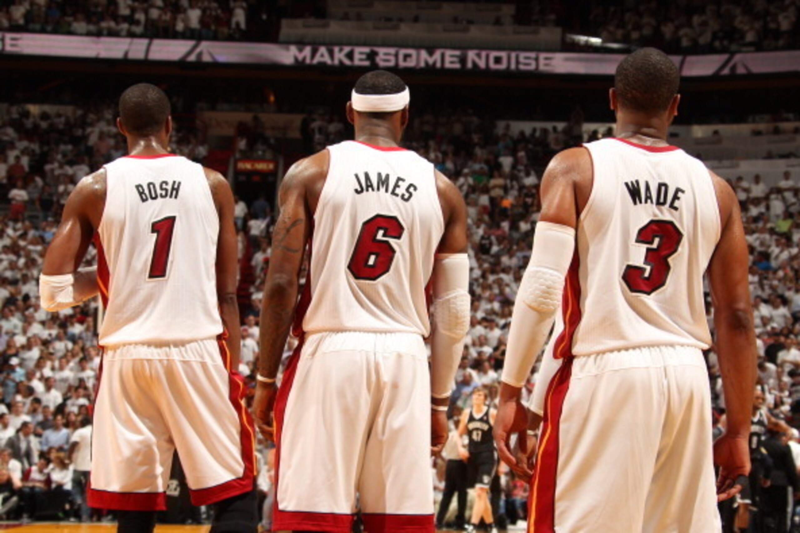 MIAMI, FL - MAY 14: Chris Bosh #1, LeBron James #6, and Dwyane Wade #3 of the Miami Heat stand in Game Five of the Eastern Conference Semifinals against the Brooklyn Nets during the 2014 NBA playoffs at American Airlines Arena in Miami, Florida on May 14,