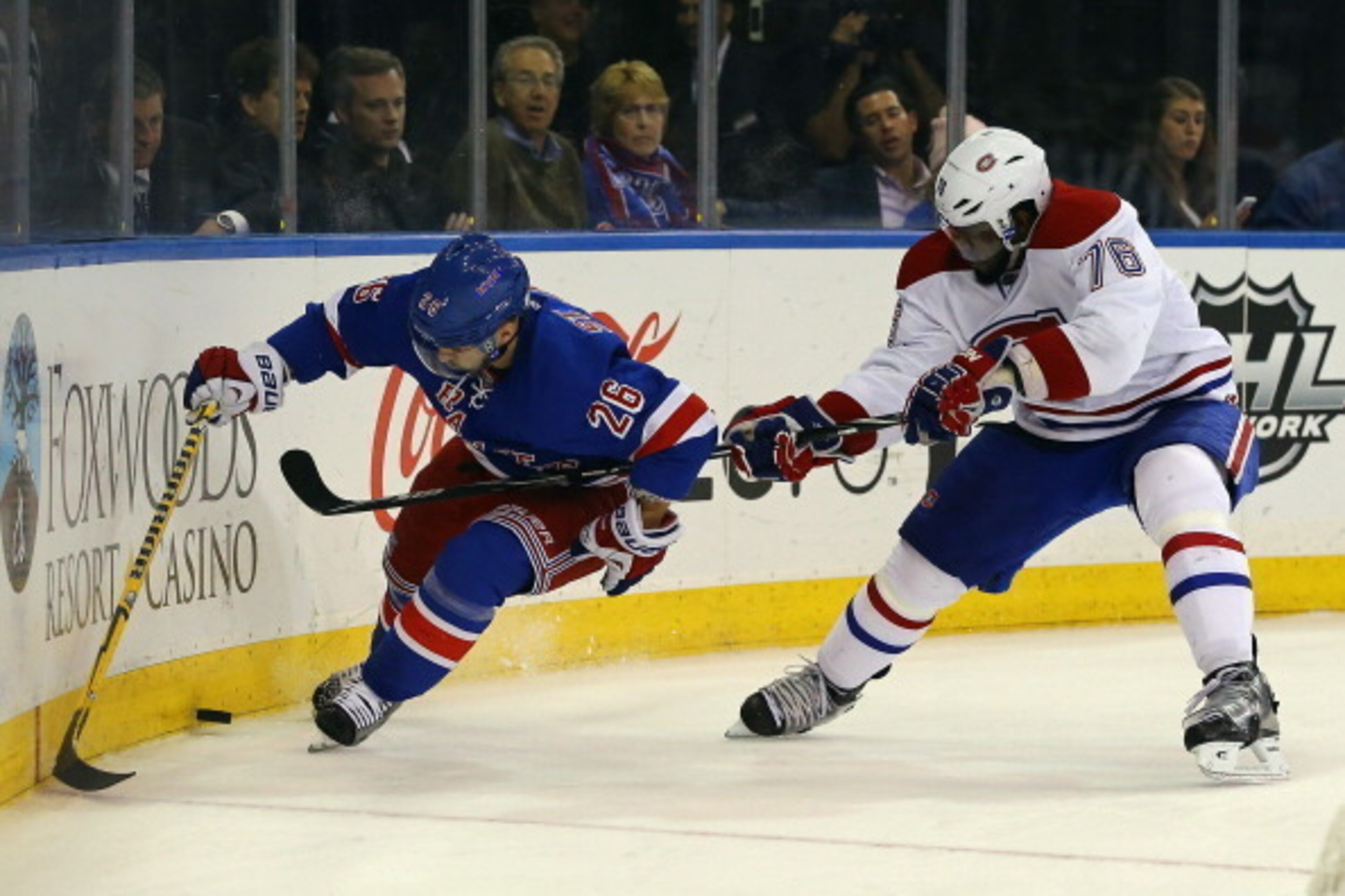NEW YORK, NY - MAY 22: Martin St. Louis #26 of the New York Rangers plays the puck along the boards behind the net against P.K. Subban #76 of the Montreal Canadiens in Game Three of the Eastern Conference Final during the 2014 NHL Stanley Cup Playoffs at NEW YORK, NY - MAY 22: Martin St. Louis #26 of the New York Rangers plays the puck along the boards behind the net against P.K. Subban #76 of the Montreal Canadiens in Game Three of the Eastern Conference Final during the 2014 NHL Stanley Cup Playoffs at