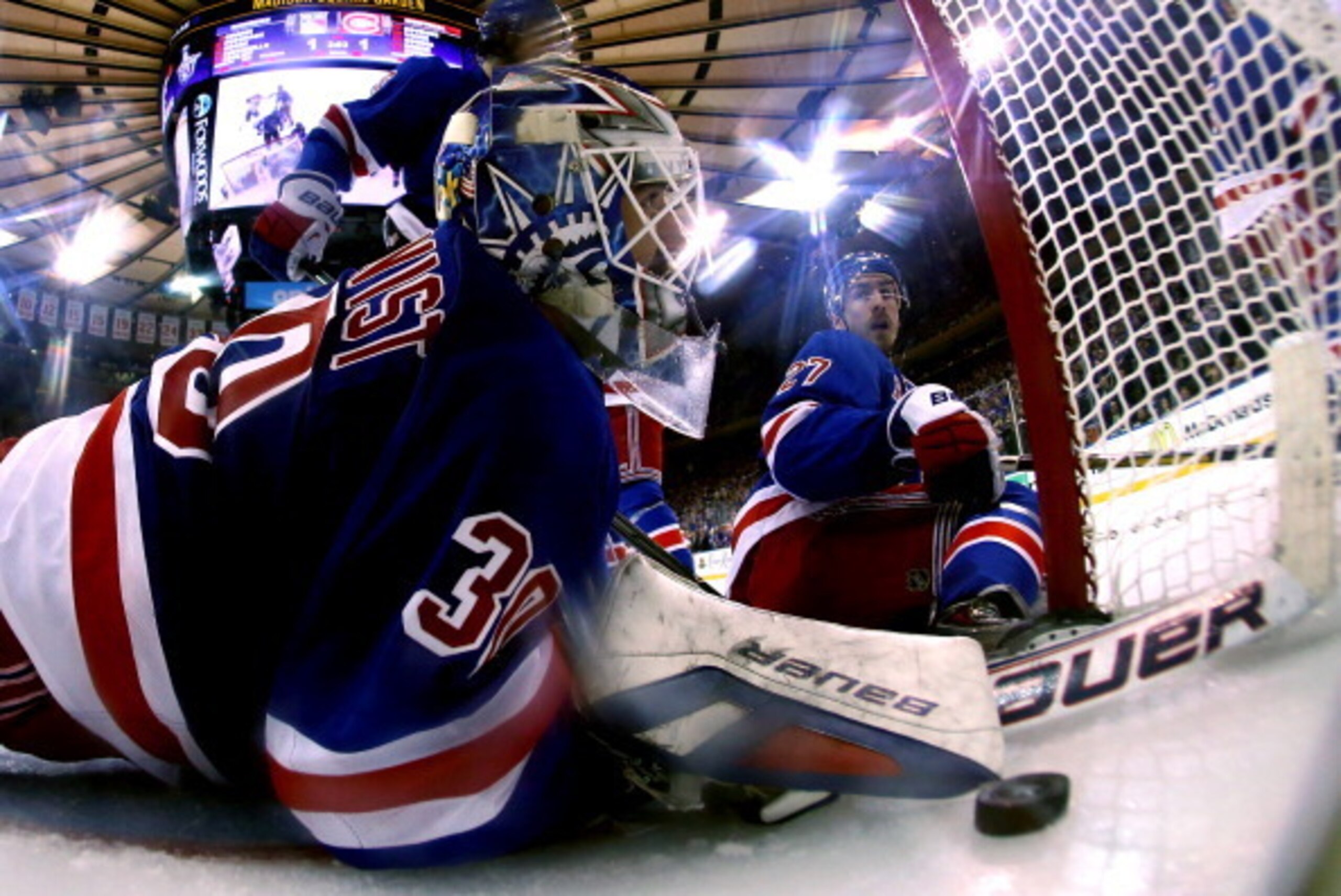 NEW YORK, NY - MAY 22:  Henrik Lundqvist #30 and Chris Kreider #20 of the New York Rangers watches Daniel Briere #48 of the Montreal Canadiens (not pictured) goal into the back of the net in Game Three of the Eastern Conference Final during the 2014 NHL S