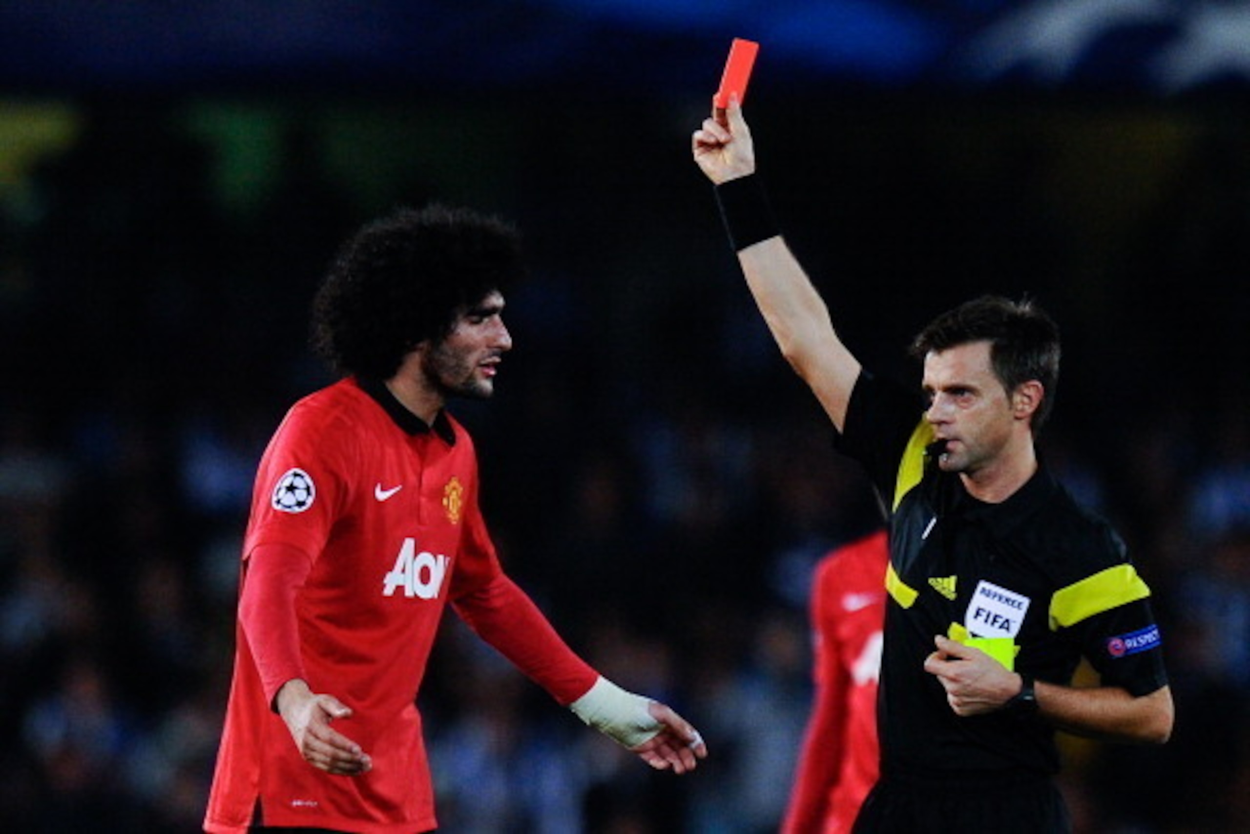 SAN SEBASTIAN, SPAIN - NOVEMBER 05:  Marouanne Fellaini of Manchester United is shown a red card by the referee Nicola Rizzoli for a challenge during the UEFA Champions League Group A match between Real Sociedad de Futbol and Manchester United at Estadio 