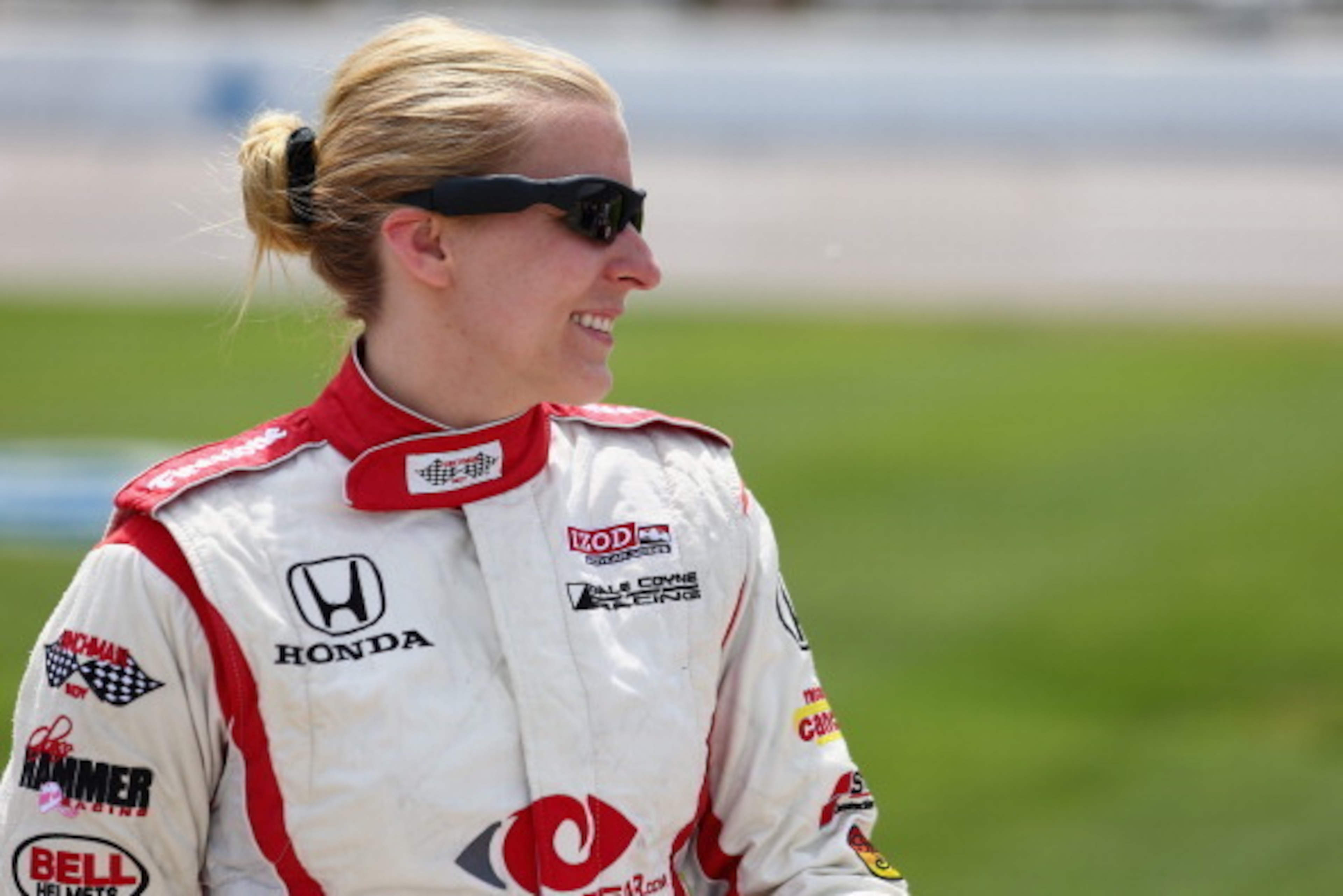 FORT WORTH, TX - JUNE 07:  Pippa Mann of England, driver of the #18 CyclopsGear.com Dale Coyne Racing Honda, stands on the grid during qualifying for the IZOD IndyCar Series Firestone 550 at Texas Motor Speedway on June 7, 2013 in Fort Worth, Texas.  (Pho