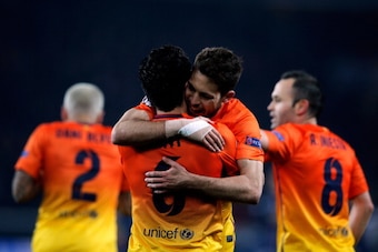 PARIS, FRANCE - APRIL 02:  Xavi (#6) of Barcelona celebrates scoring a penalty for his teams second goal with Jordi Alba during the UEFA Champions League Quarter Final match between Paris Saint-Germain and Barcelona FCB at Parc des Princes on April 2, 201