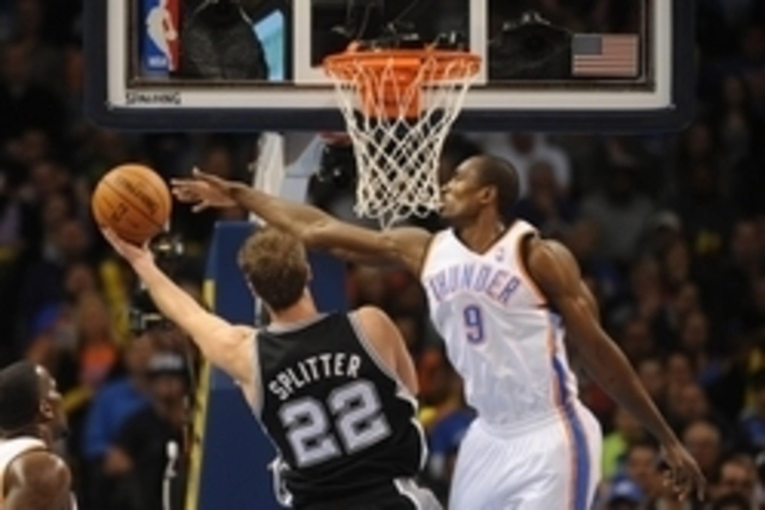 Nov 27, 2013; Oklahoma City, OK, USA; Oklahoma City Thunder power forward Serge Ibaka (9) attempts to block a shot attempt by San Antonio Spurs center Tiago Splitter (22) during the second quarter at Chesapeake Energy Arena. Mandatory Credit: Mark D. Smit Nov 27, 2013; Oklahoma City, OK, USA; Oklahoma City Thunder power forward Serge Ibaka (9) attempts to block a shot attempt by San Antonio Spurs center Tiago Splitter (22) during the second quarter at Chesapeake Energy Arena. Mandatory Credit: Mark D. Smit