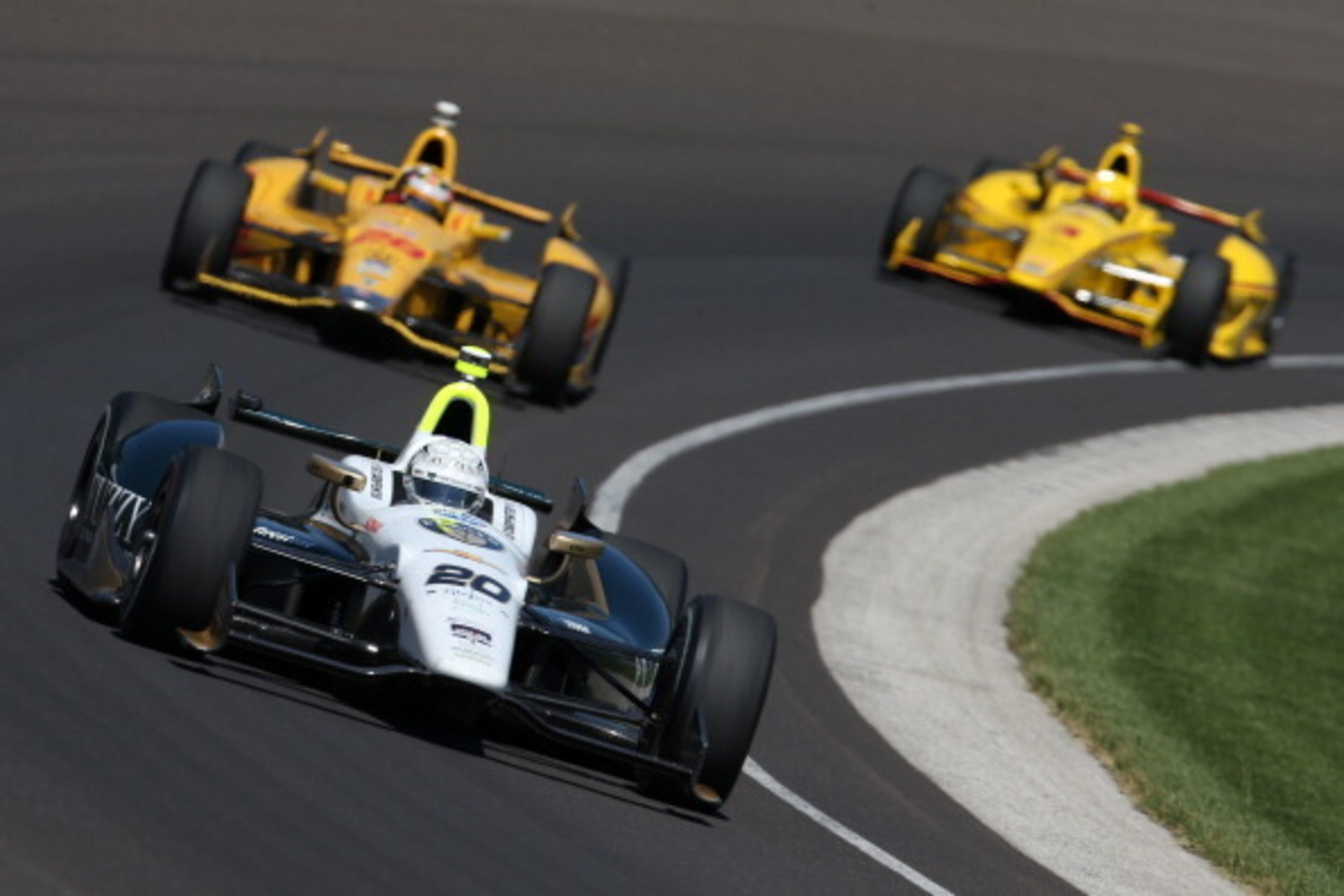 INDIANAPOLIS, IN - MAY 23: Ed Carpenter, driver of the #20 Fuzzy's Vodka / Ed Carpenter Racing Chevrolet Dallara, leads a pack of cars during final practice on Carb Day for the 98th running of the Indianapolis 500 Mile Race on May 23, 2014 at Indianapoli INDIANAPOLIS, IN - MAY 23: Ed Carpenter, driver of the #20 Fuzzy's Vodka / Ed Carpenter Racing Chevrolet Dallara, leads a pack of cars during final practice on Carb Day for the 98th running of the Indianapolis 500 Mile Race on May 23, 2014 at Indianapoli