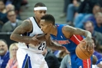 Nov 15, 2013; Sacramento, CA, USA; Detroit Pistons point guard Brandon Jennings (7) dribbles around Sacramento Kings point guard Isaiah Thomas (22) during the fourth quarter at Sleep Train Arena. The Detroit Pistons defeated the Sacramento Kings 97-90. Ma