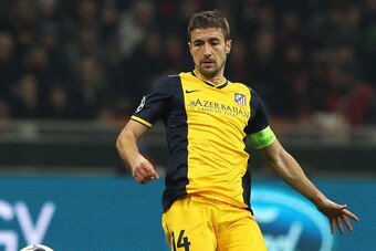 MILAN, ITALY - FEBRUARY 19:  Gabi of Club Atletico de Madrid in action during the UEFA Champions League Round of 16 match between AC Milan and Club Atletico de Madrid at Stadio Giuseppe Meazza on February 19, 2014 in Milan, Italy.  (Photo by Marco Luzzani