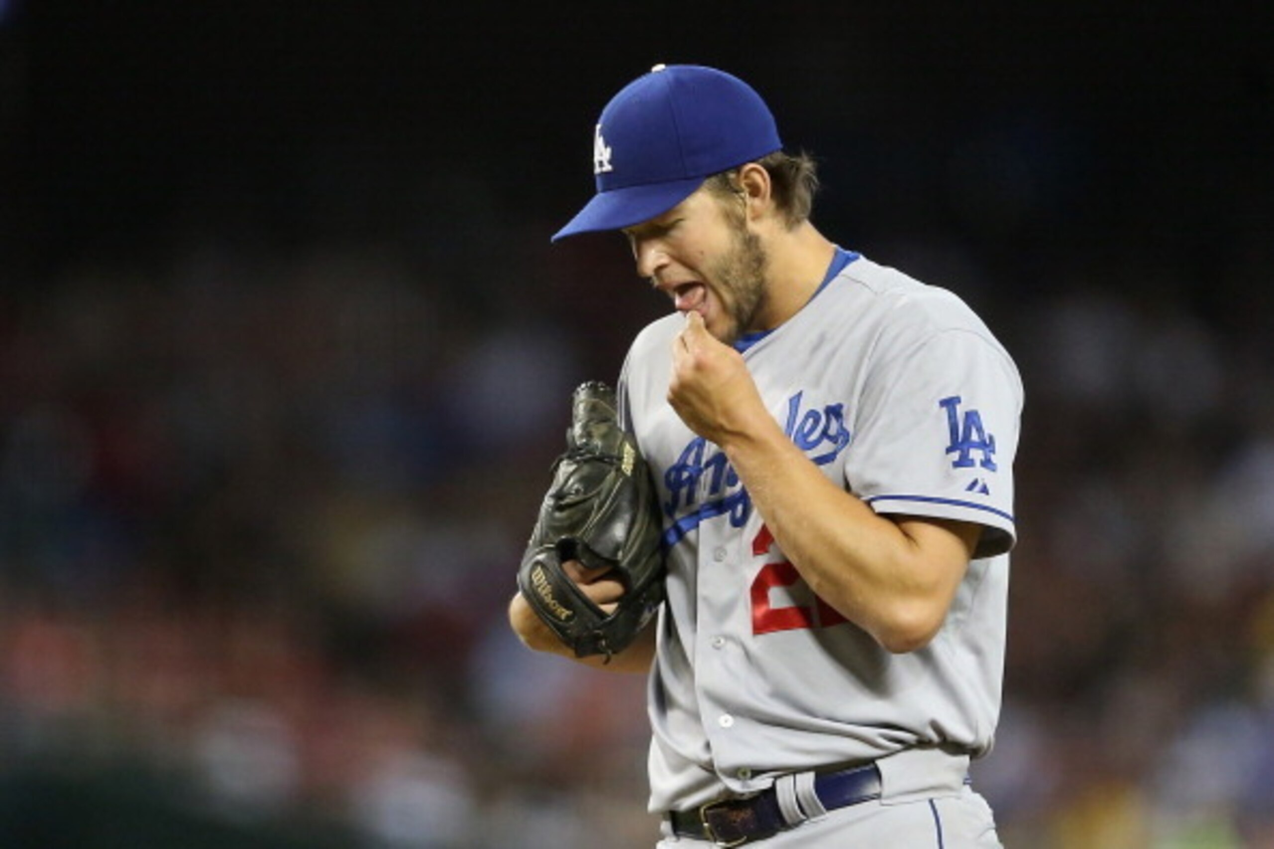 PHOENIX, AZ - MAY 17:  Starting pitcher Clayton Kershaw #22 of the Los Angeles Dodgers prepares to pitch against the Arizona Diamondbacks during the MLB game at Chase Field on May 17, 2014 in Phoenix, Arizona.  The Diamondbacks defeated the Dodgers 18-7. 