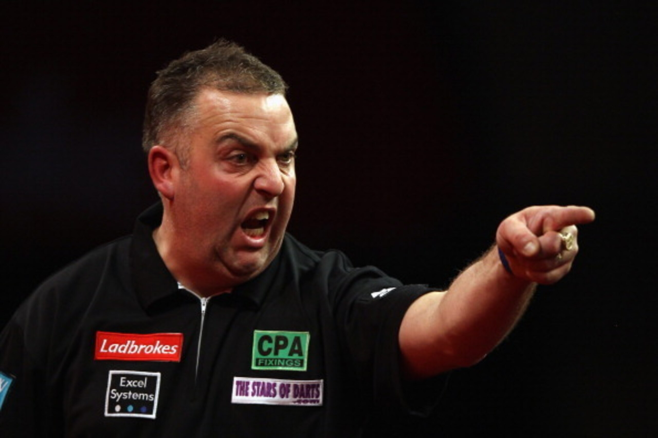 LONDON, ENGLAND - DECEMBER 18:  James Richardson of Great Britain reacts during his first round match against Raymond van Barneveld of The Netherlands during day four of the 2012 Ladbrokes.com World Darts Championship at Alexandra Palace on December 18, 2