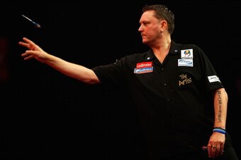 LONDON, ENGLAND - DECEMBER 27: Kevin Painter of England in action during his third round match against Simon Whitlock of Australia on day twelve of the Ladbrokes.com World Darts Championship at Alexandra Palace on December 27, 2013 in London, England.  (P