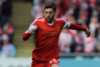 SWANSEA, WALES - MAY 03: Adam Lallana of Southampton in action during the Barclays Premier League match between Swansea City and Southampton at Liberty Stadium on May 3, 2014 in Swansea, Wales. Photo by Steve Bardens/Getty Images)