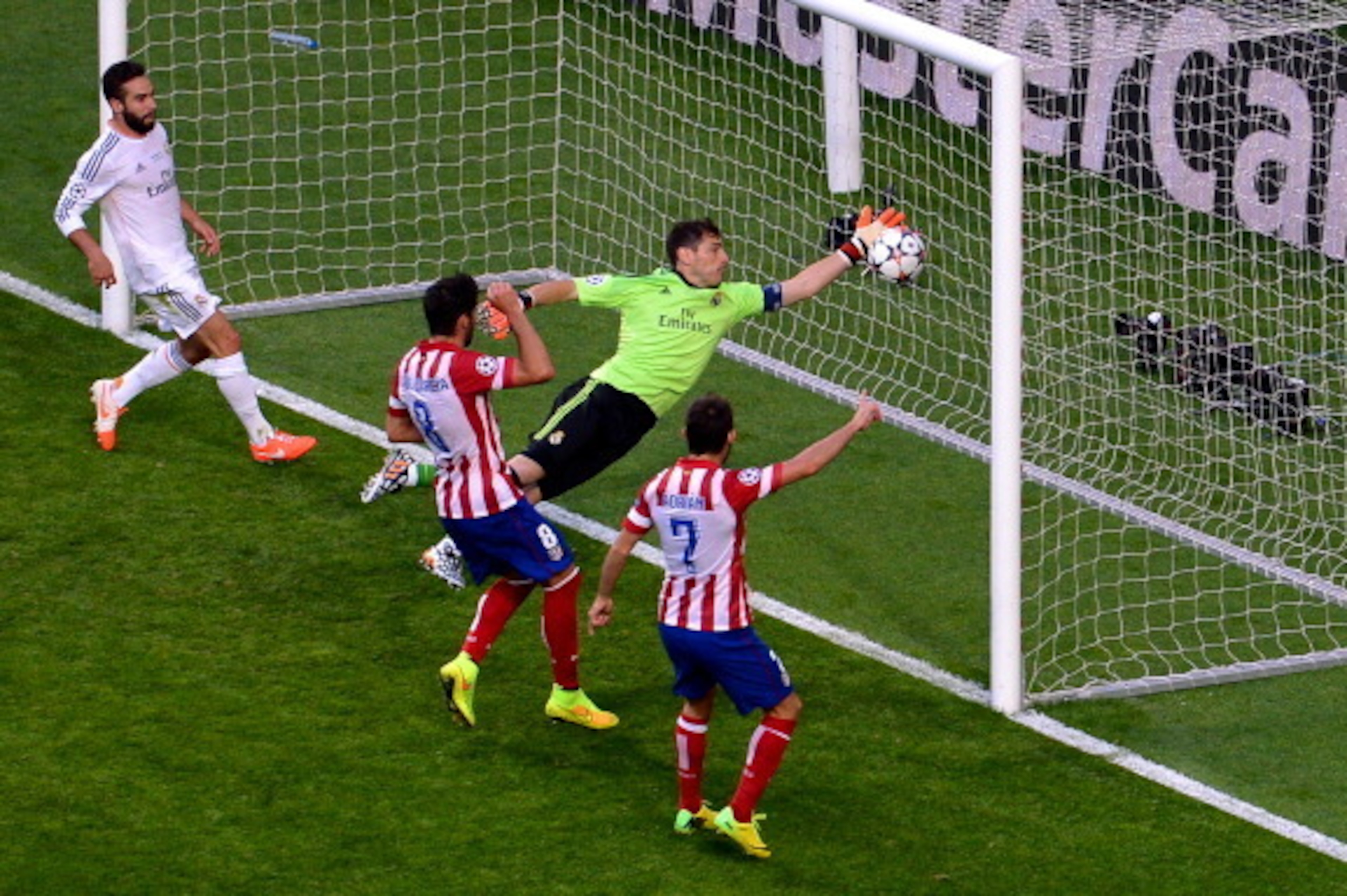 LISBON, PORTUGAL - MAY 24:  Iker Casillas of Real Madrid fails to stop the ball headed in by Diego Godin of Club Atletico de Madrid (not pictured) for the first goal during the UEFA Champions League Final between Real Madrid and Atletico de Madrid at Esta