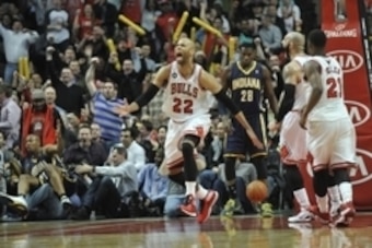 Mar 24, 2014; Chicago, IL, USA; Chicago Bulls forward Taj Gibson (22) reacts after scoring against the Indiana Pacers during the second half at the United Center. the Chicago Bulls defeated the Indiana Pacers 89-77. Mandatory Credit: David Banks-USA TODAY