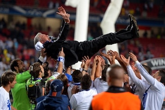 LISBON, PORTUGAL - MAY 24: Head Coach, Carlo Ancelotti of Real Madrid is lifted in celebration by his players during the UEFA Champions League Final between Real Madrid and Atletico de Madrid at Estadio da Luz on May 24, 2014 in Lisbon, Portugal.  (Photo 