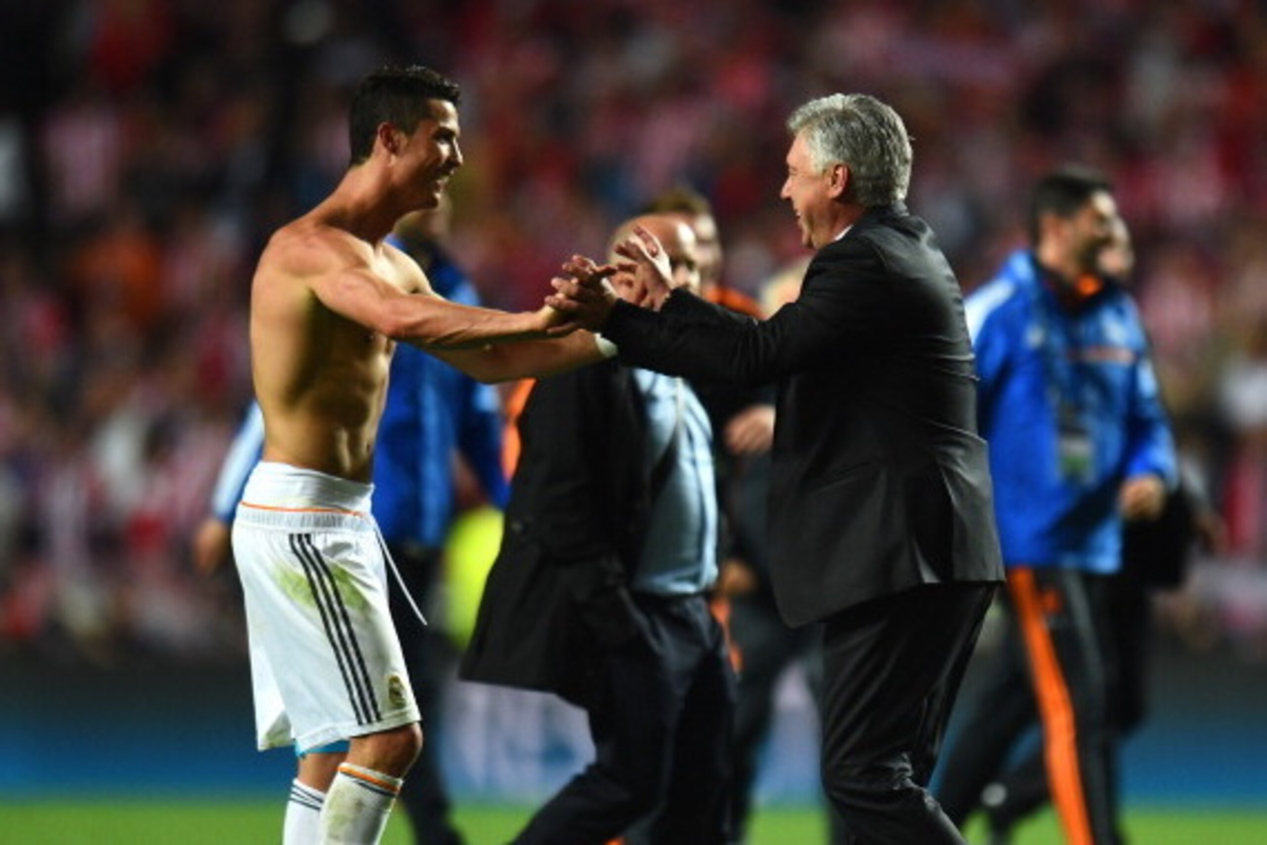 LISBON, PORTUGAL - MAY 24:  Cristiano Ronaldo of Real Madrid celebrates victory with Head Coach, Carlo Ancelotti of Real Madrid during the UEFA Champions League Final between Real Madrid and Atletico de Madrid at Estadio da Luz on May 24, 2014 in Lisbon, 