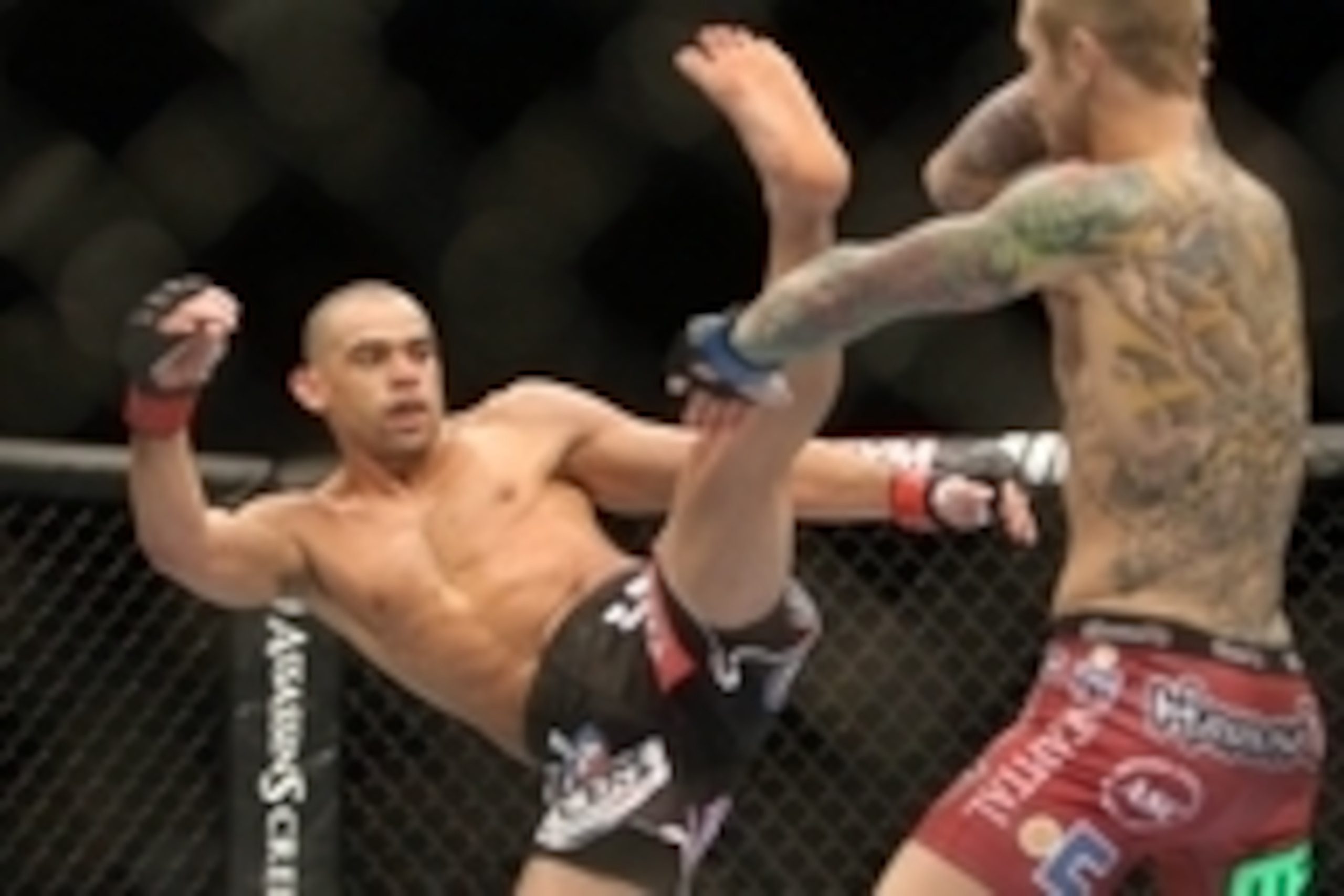 Sep 21, 2013; Toronto, Ontario, CAN; Renan Barao (left) throws a kick at Eddie Wineland during their interim bantamweight championship bout at UFC 165 at the Air Canada Centre. Mandatory Credit: Tom Szczerbowski-USA TODAY Sports