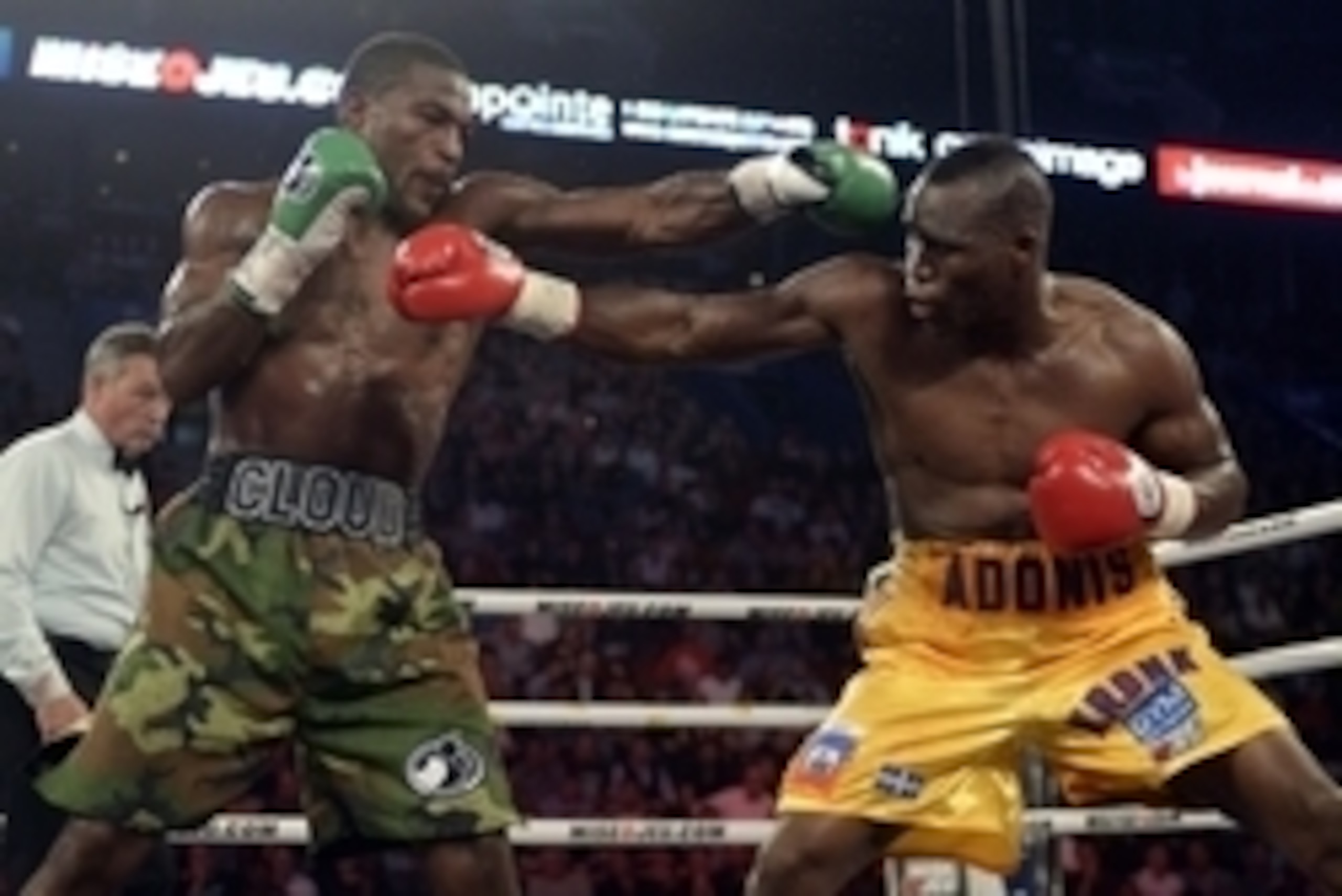 Sep 28, 2013; Montreal, Quebec, Canada;  Adonis Stevenson (yellow trunks) and Tavoris Cloud (cammo trunks) box during their light-heavyweight WBC world championship bout at the Bell Centre. Mandatory Credit: Eric Bolte-USA TODAY Sports