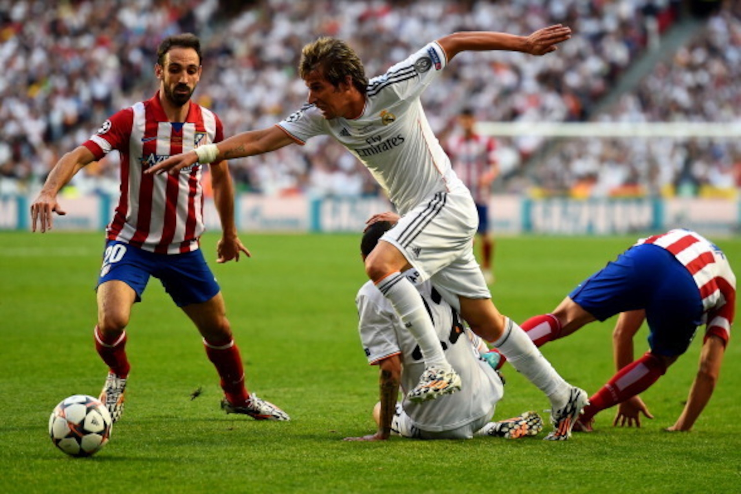 LISBON, PORTUGAL - MAY 24:  Juanfran and Gabi of Club Atletico de Madrid close down Ángel Di Maria and Fabio Coentrao of Real Madrid during the UEFA Champions League Final between Real Madrid and Atletico de Madrid at Estadio da Luz on May 24, 2014 in Lis