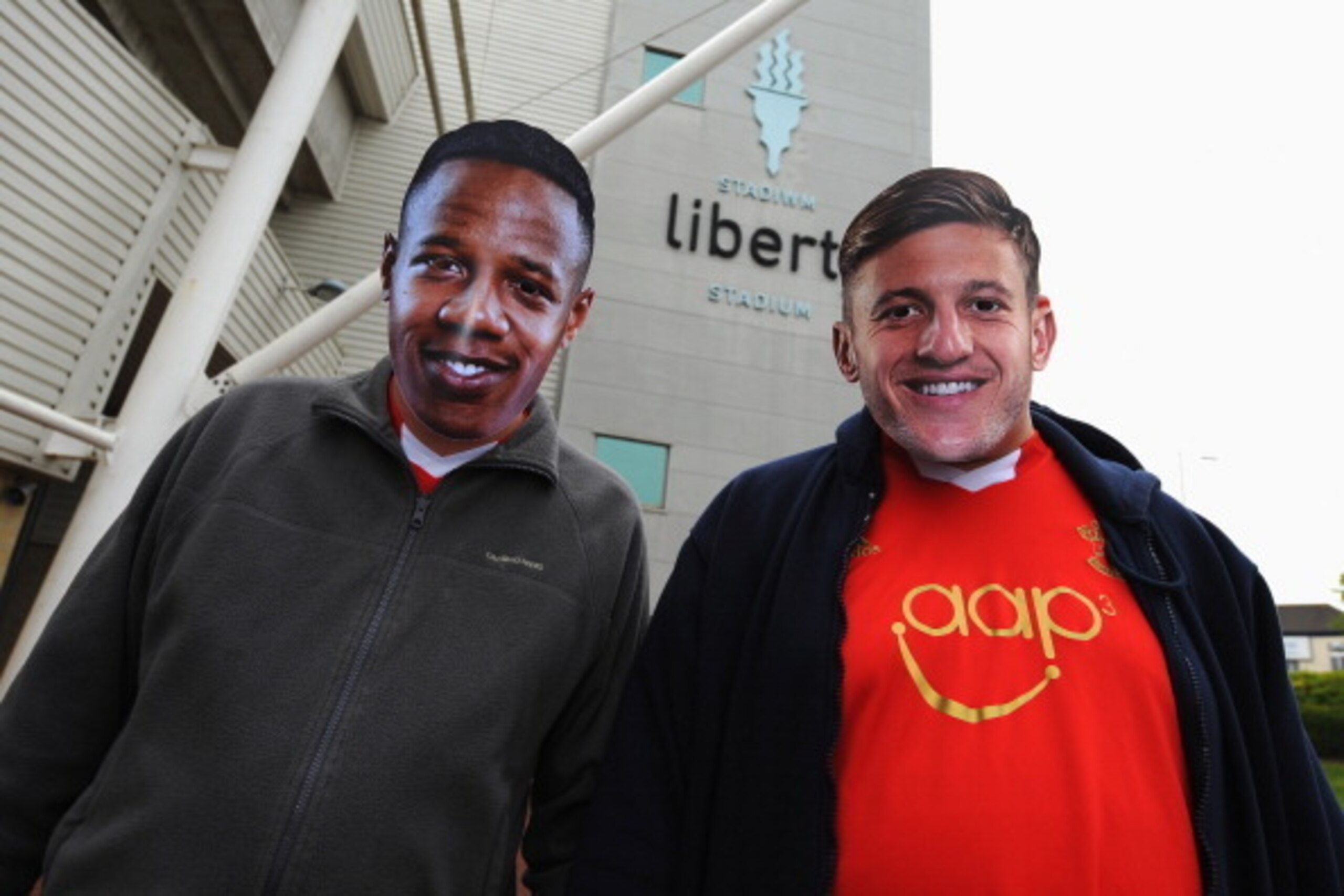 SWANSEA, WALES - MAY 03:  Southampton fans wear 'Nathaniel Clyne' and 'Adam Lallana' masks during the Barclays Premier League match between Swansea City and Southampton at Liberty Stadium on May 3, 2014 in Swansea, Wales.  (Photo by Steve Bardens/Getty Im