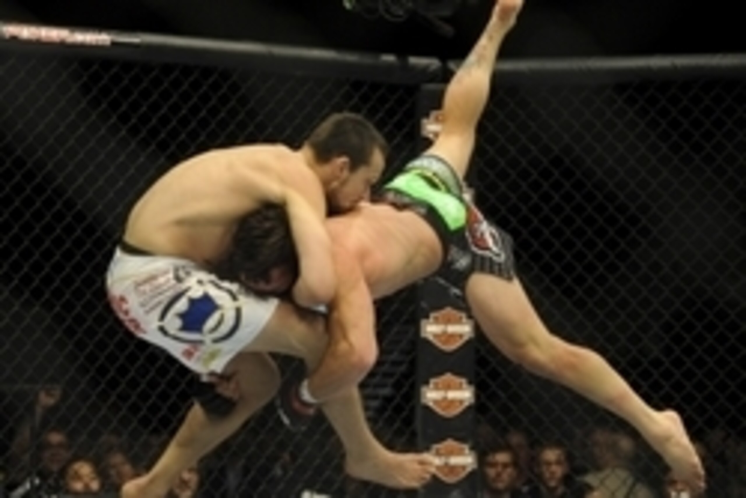 May 24, 2014; Las Vegas, NV, USA; Jamie Varner (red) is slammed to the mat by his opponent James Krause (blue) during their UFC 173 bantamweight bout at MGM Grand Garden Arena. Krause won his bout by TKO.  Mandatory Credit: Stephen R. Sylvanie-USA TODAY S
