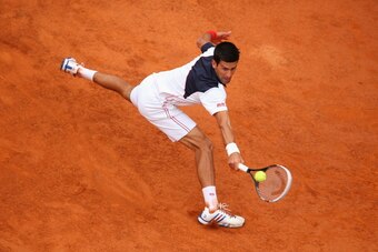 ROME, ITALY - MAY 18:  Novak Djokovic of Serbia in action in his match against Rafael Nadal of Spain in the final during day eight of the Internazionali BNL d'Italia tennis 2014 on May 18, 2014 in Rome, Italy.  (Photo by Julian Finney/Getty Images)