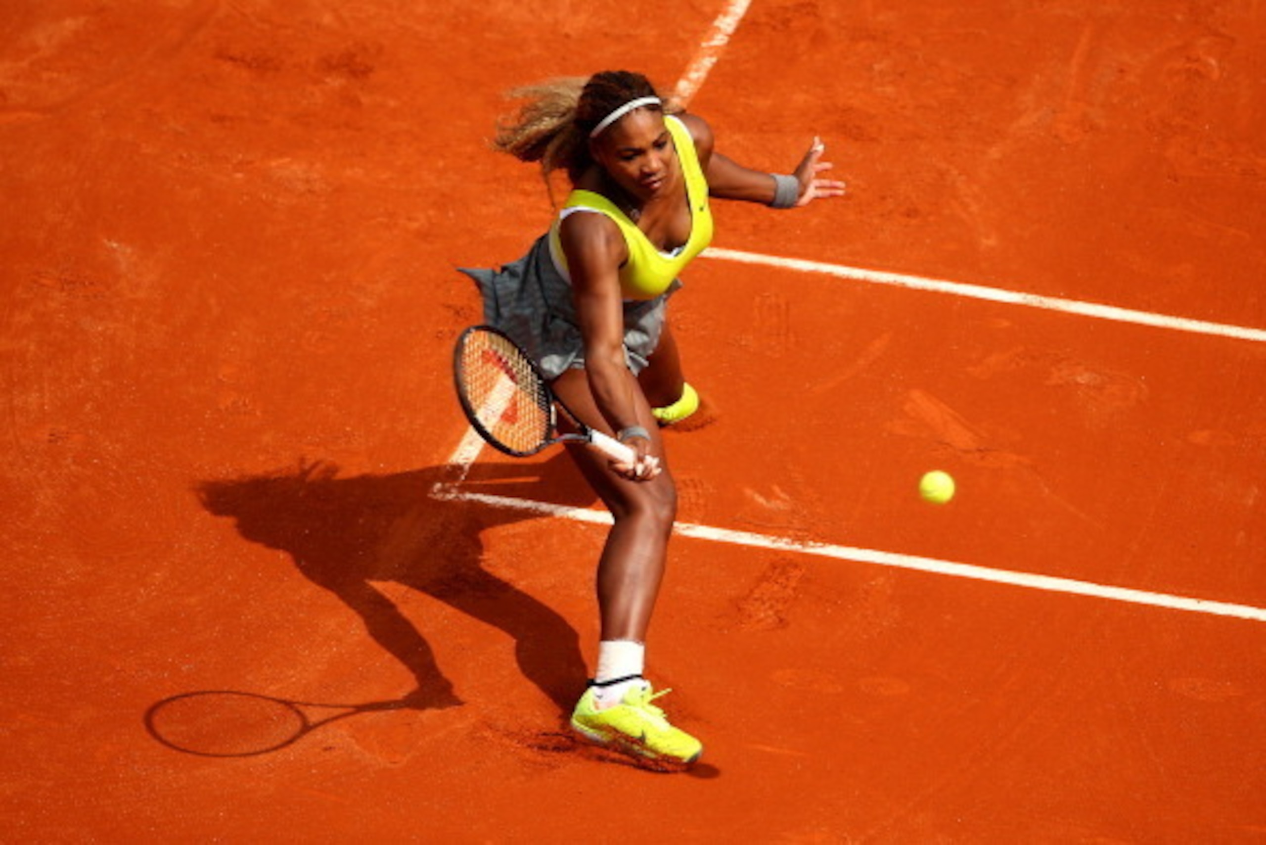 PARIS, FRANCE - MAY 25:  Serena Williams of the United States returns a shot during her women's singles match against Alize Lim of France on day one of the French Open at Roland Garros on May 25, 2014 in Paris, France.  (Photo by Clive Brunskill/Getty Ima