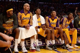 LOS ANGELES, CA - MARCH 25:  (L-R) Jordan Hill #27, Robert Sacre #50, Nick Young #0, Wesley Johnson #11 and MarShon Brooks #2 of the Los Angeles Lakers look on during a win over the New York Knicks at Staples Center on March 25, 2014 in Los Angeles, Calif